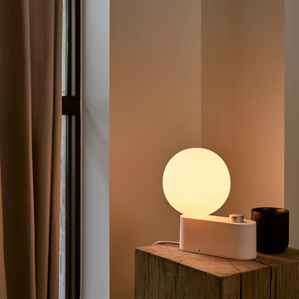 a table lamp sitting on top of a wooden table