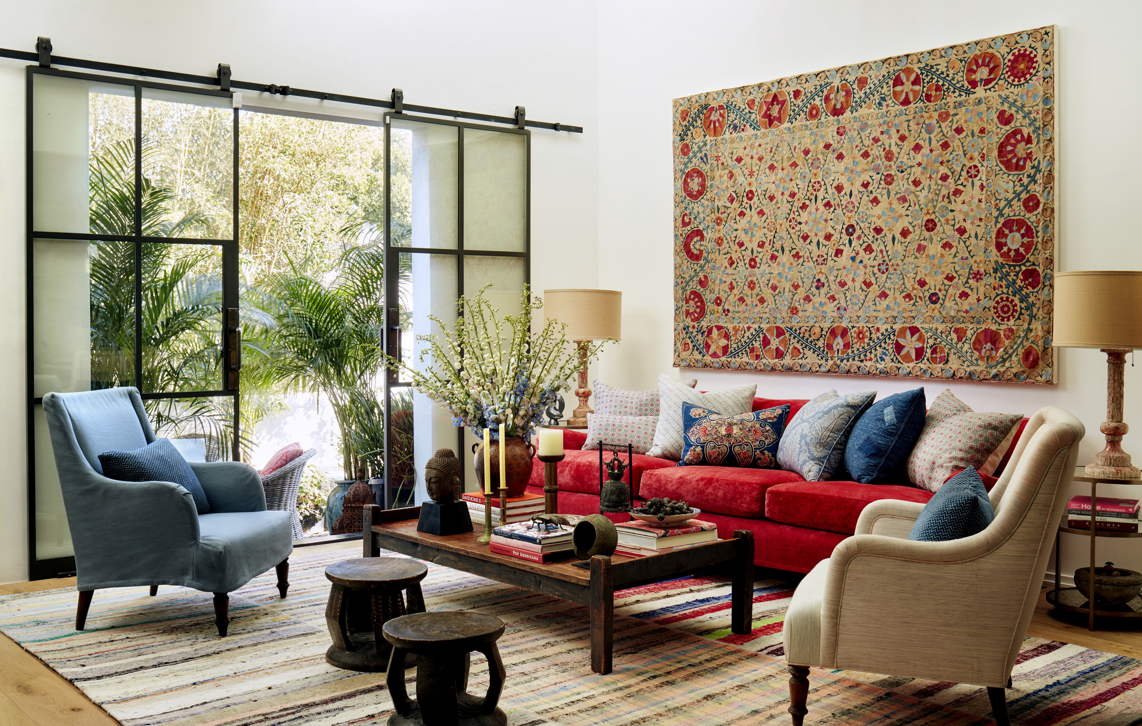 a living room filled with furniture and a rug