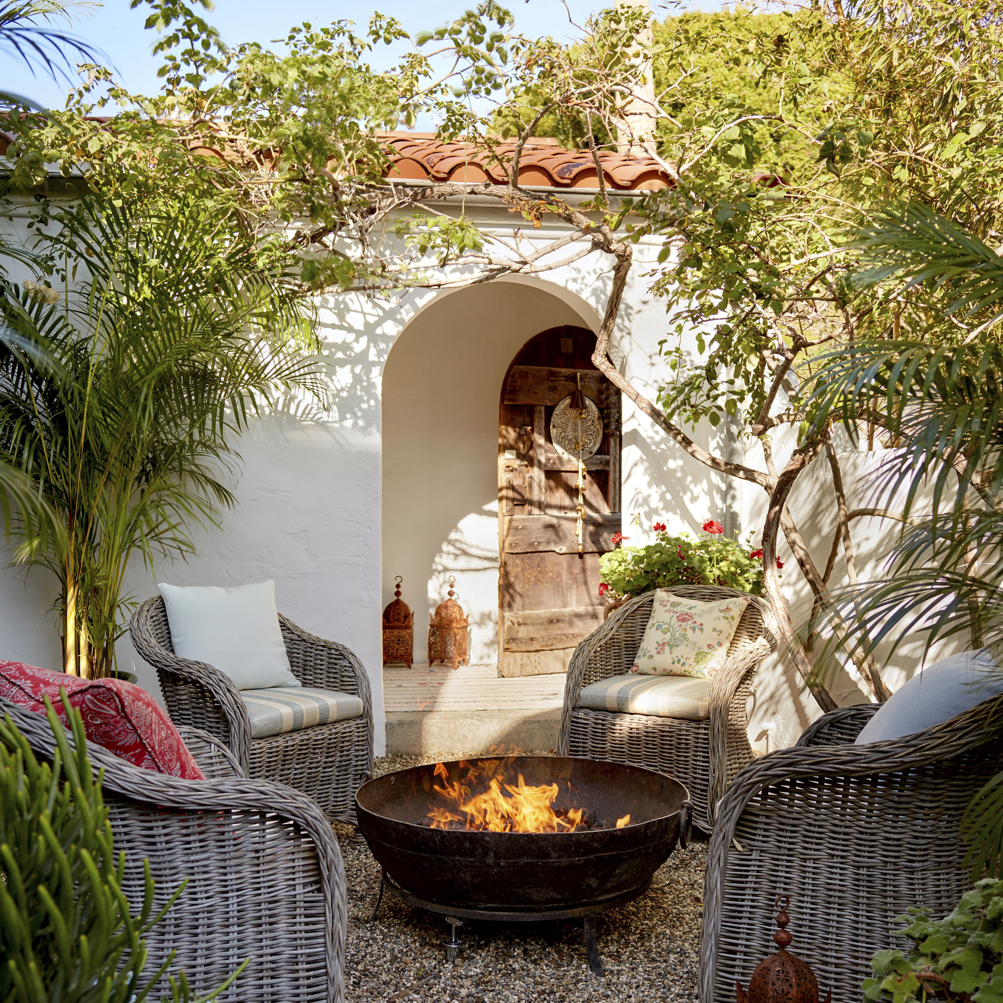 a fire pit in the middle of a patio