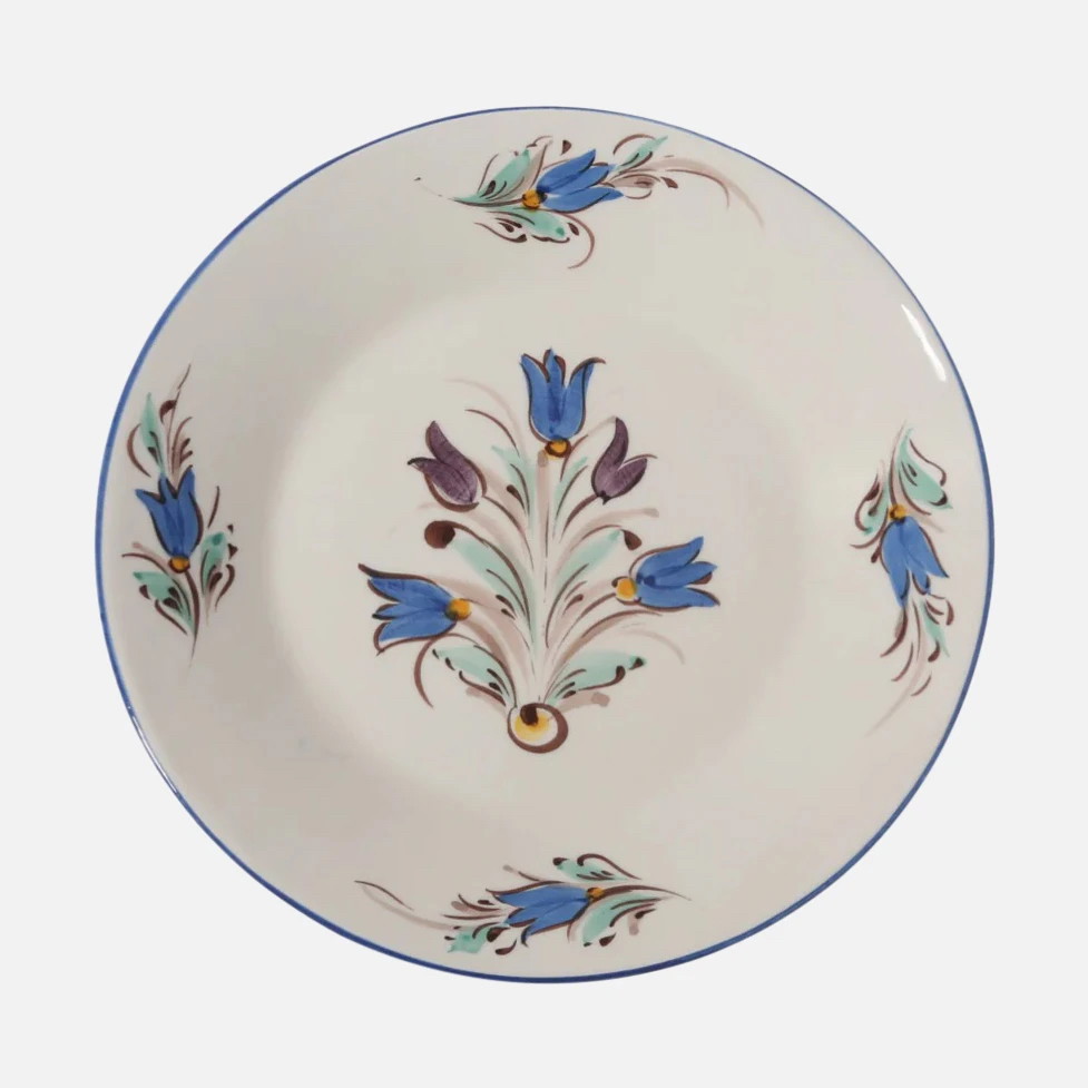 a white plate with blue flowers on it
