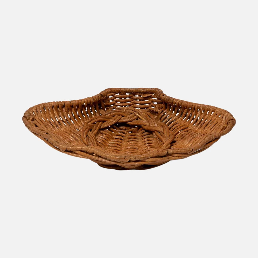 a wicker basket is shown on a white background