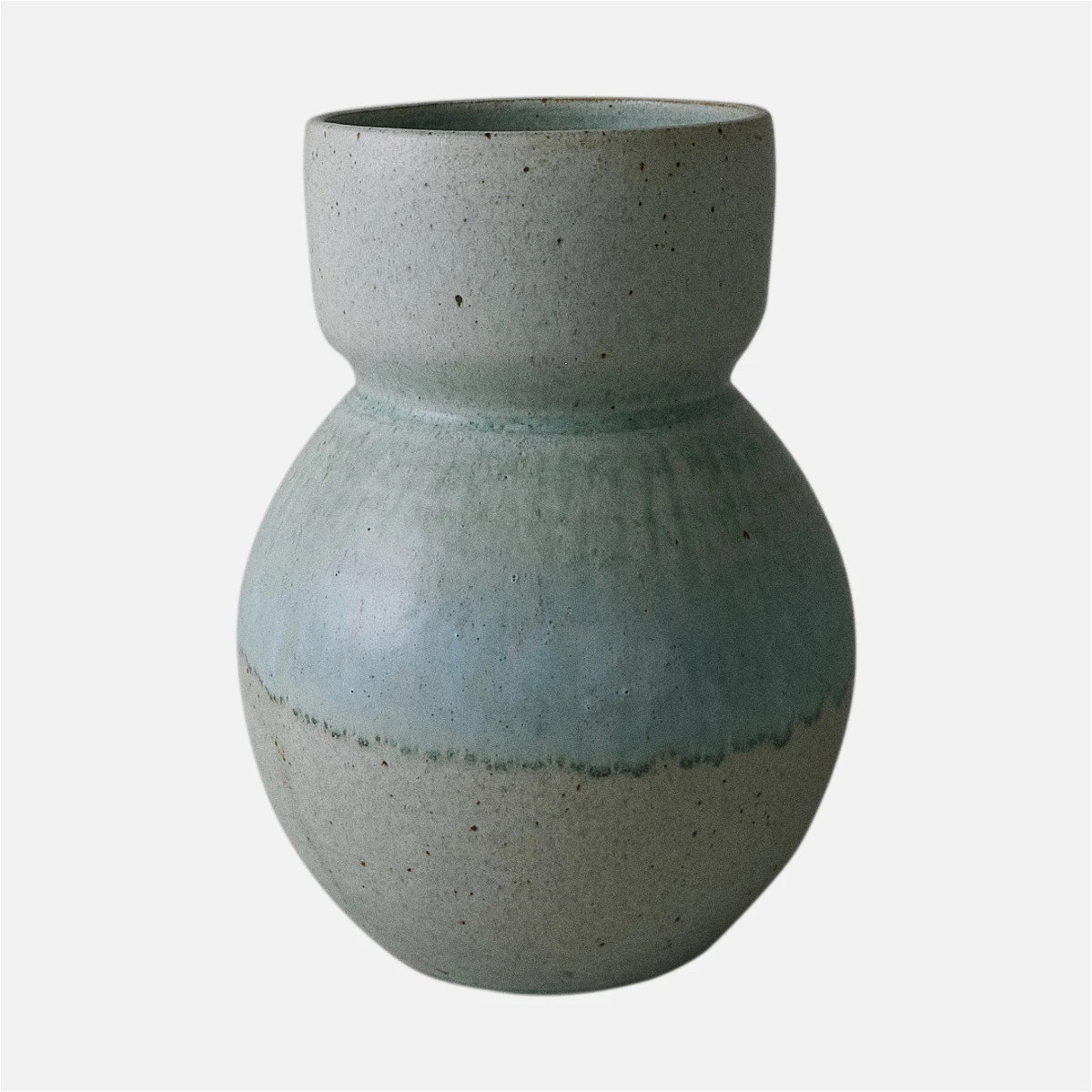 a blue vase with a white base on a white background