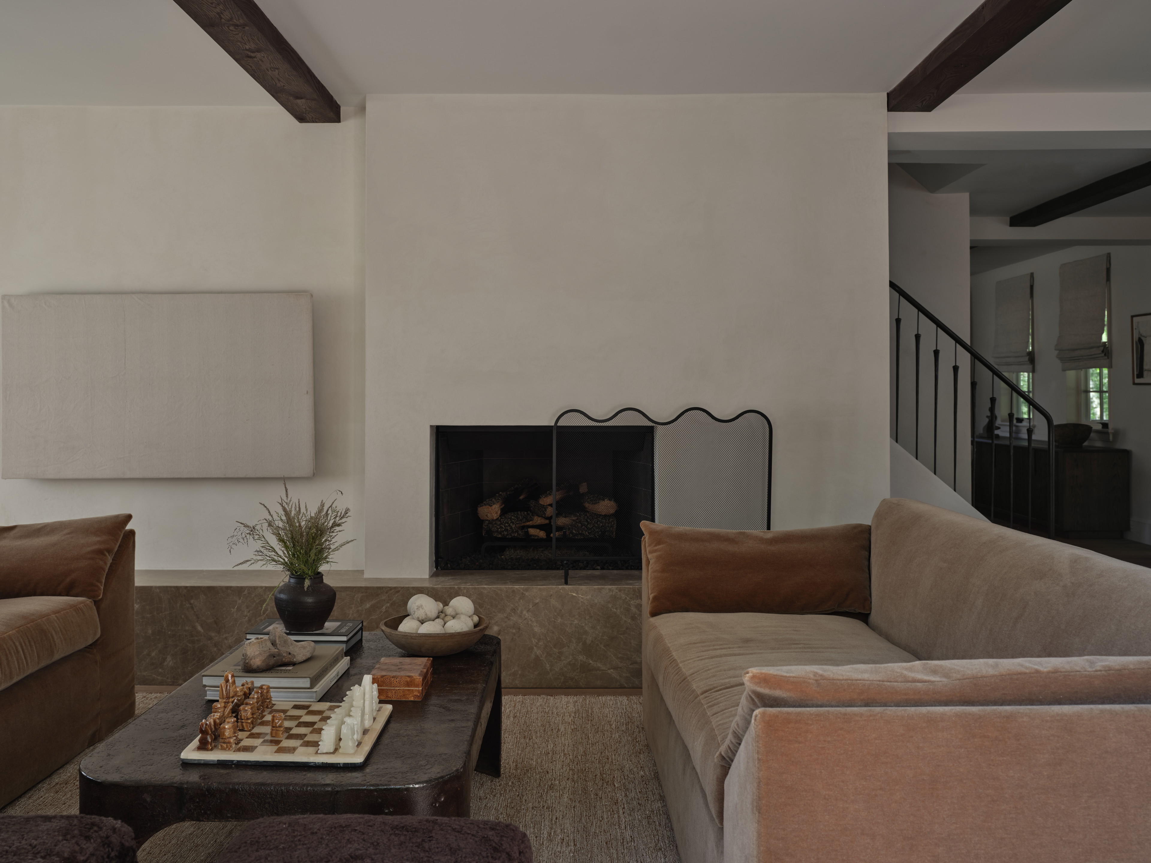 a living room filled with furniture and a fire place