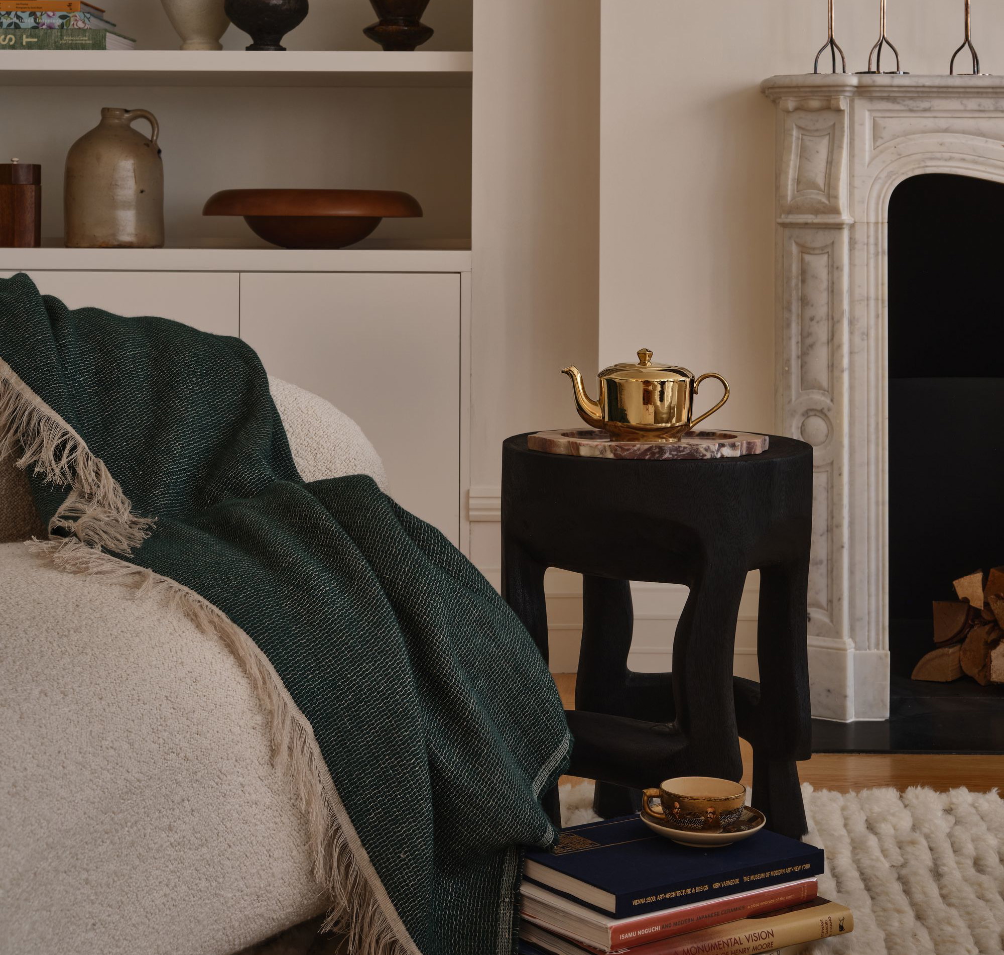 a living room with a fire place and a fireplace