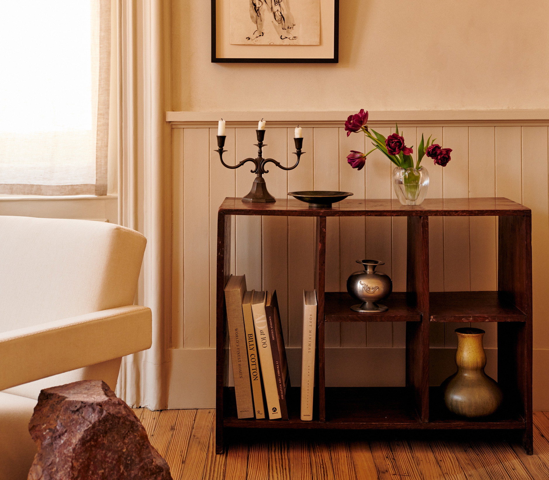 a table with a vase of flowers on top of it