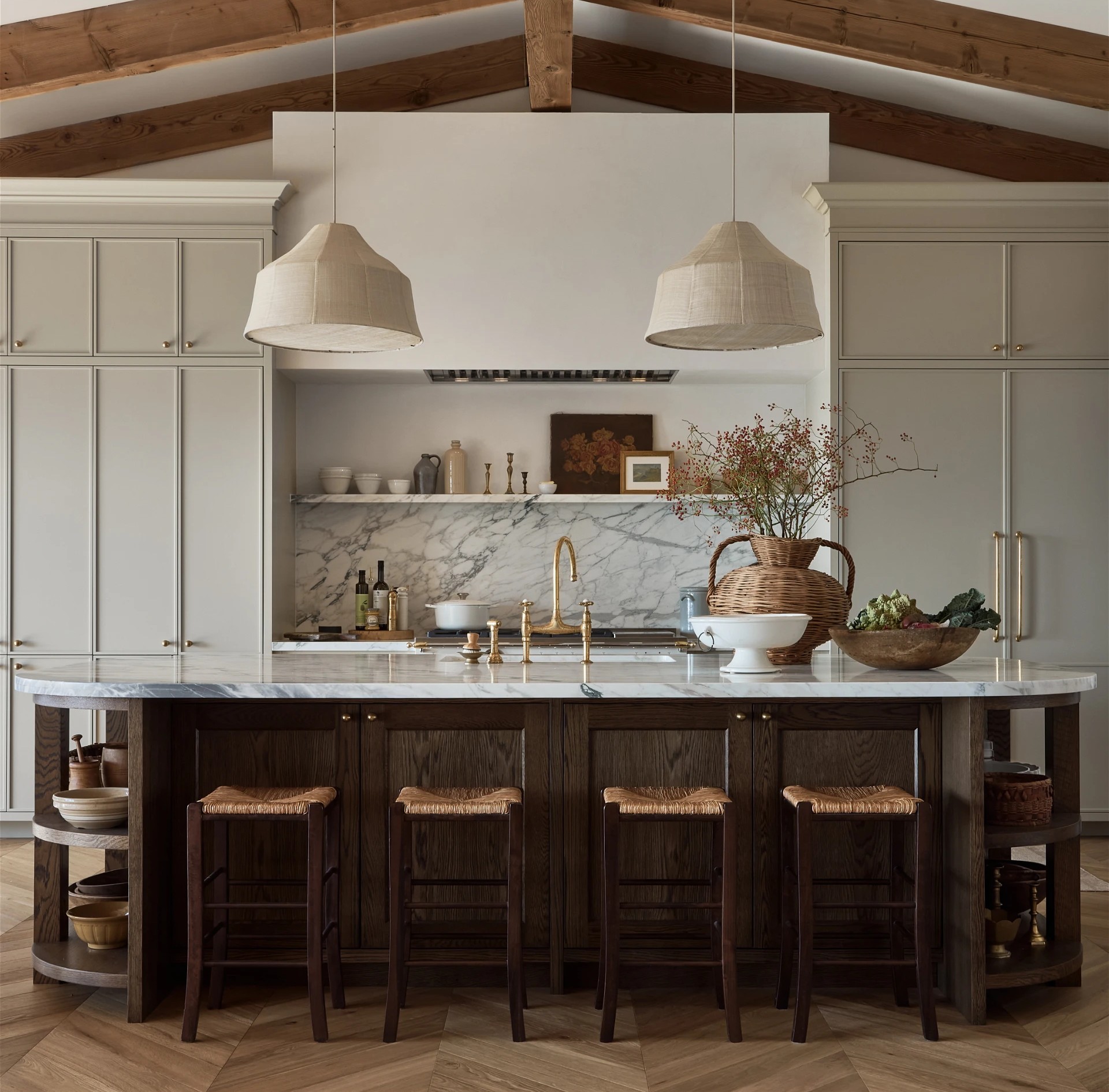a large kitchen with a center island with stools