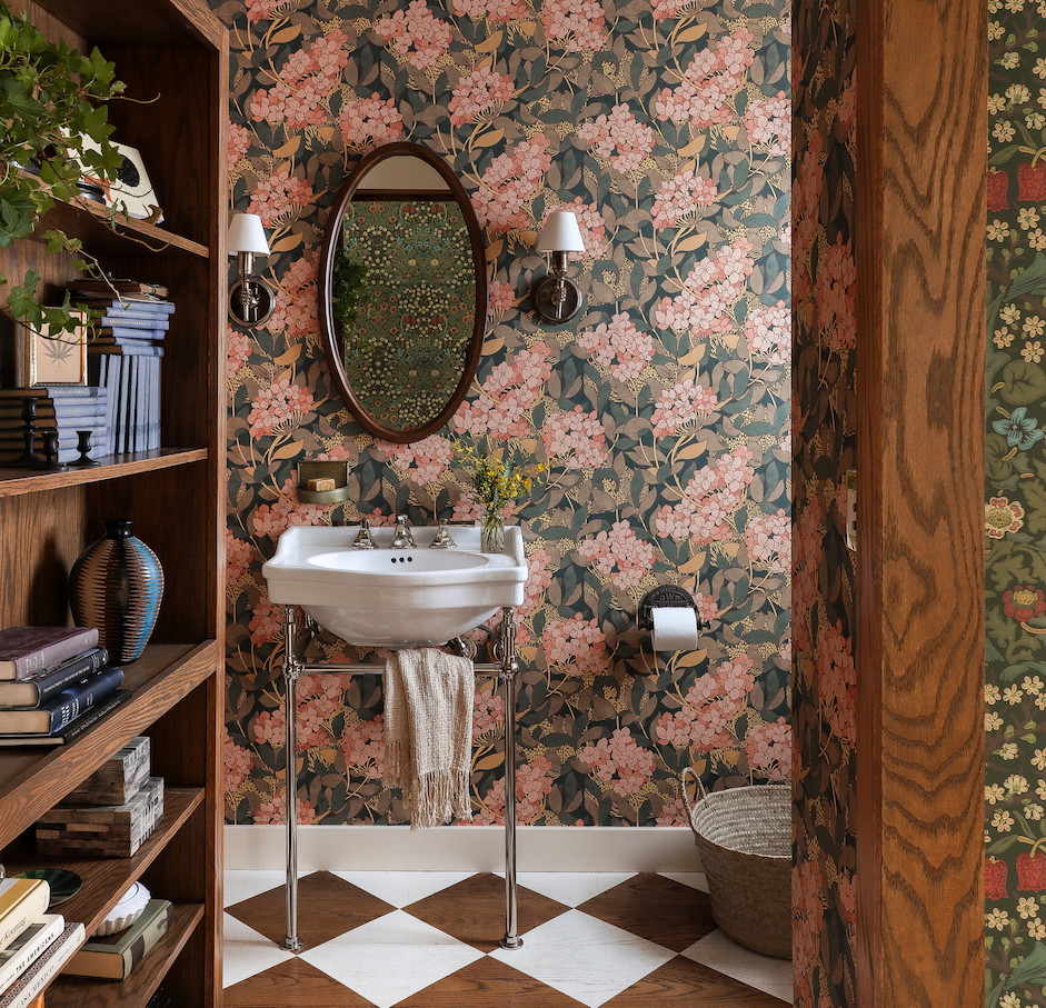 a bathroom with a checkered floor and floral wallpaper