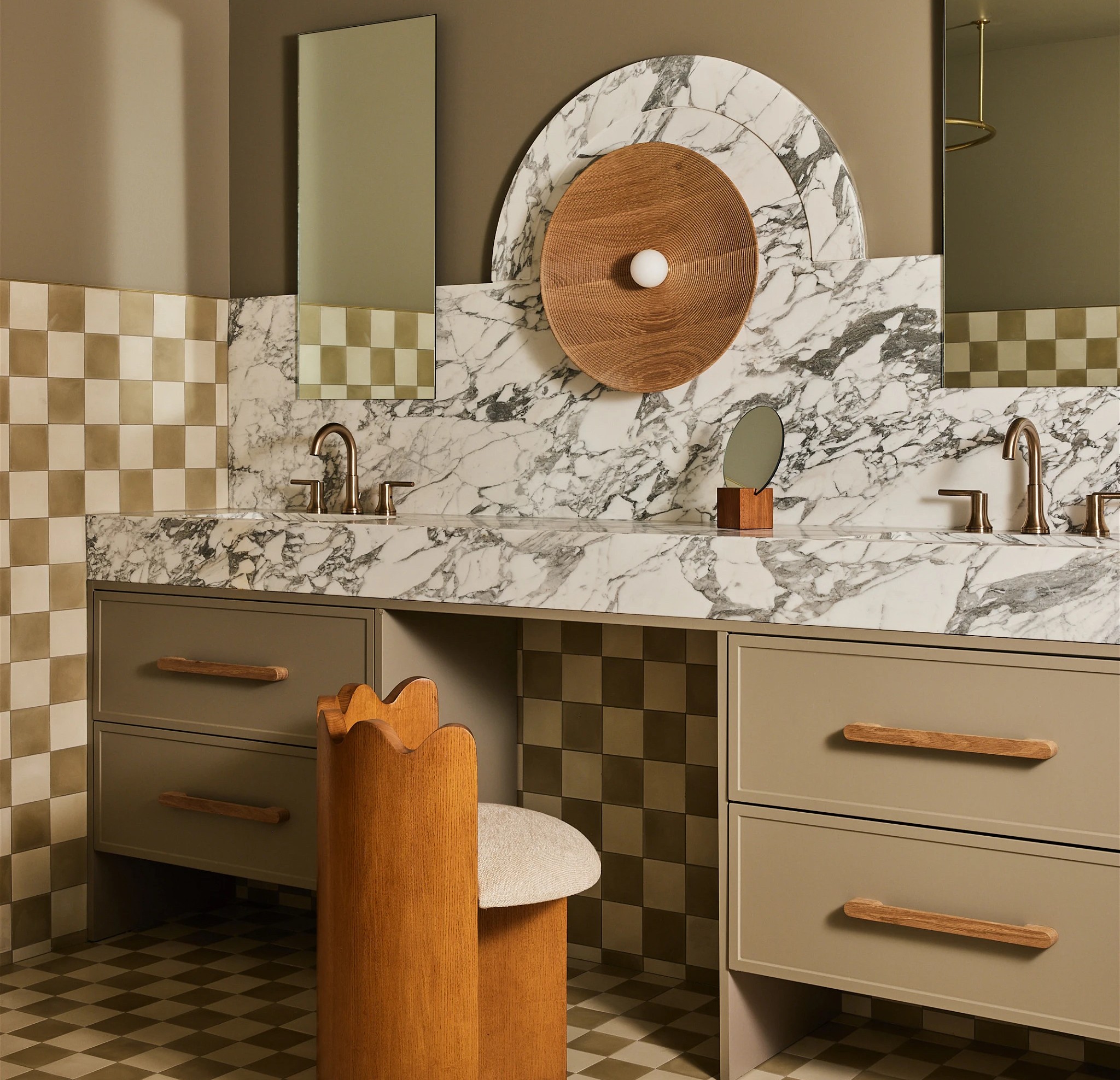 a bathroom with a checkered floor and marble counter tops