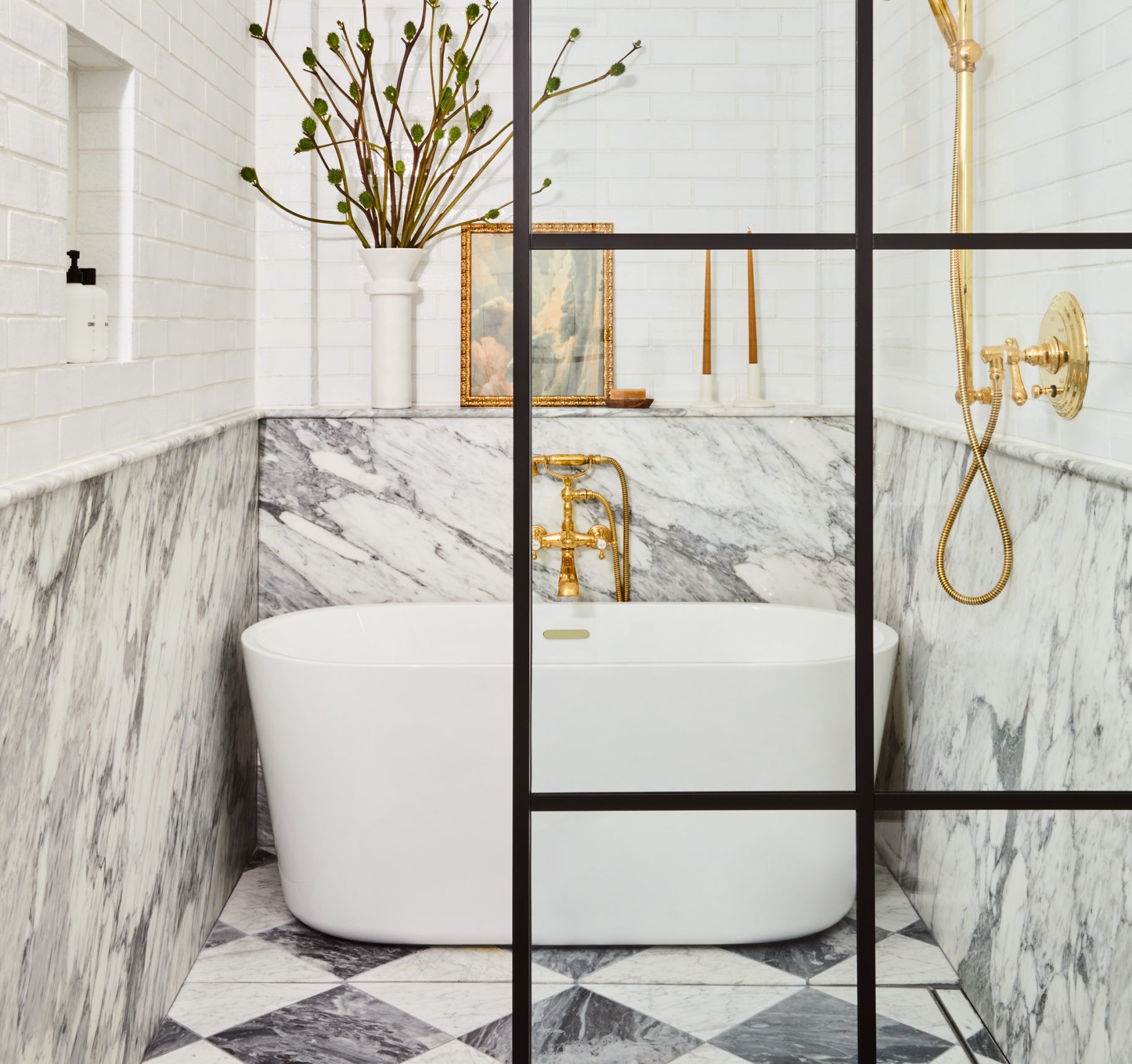 a bathroom with a white tub and black and white checkered floor