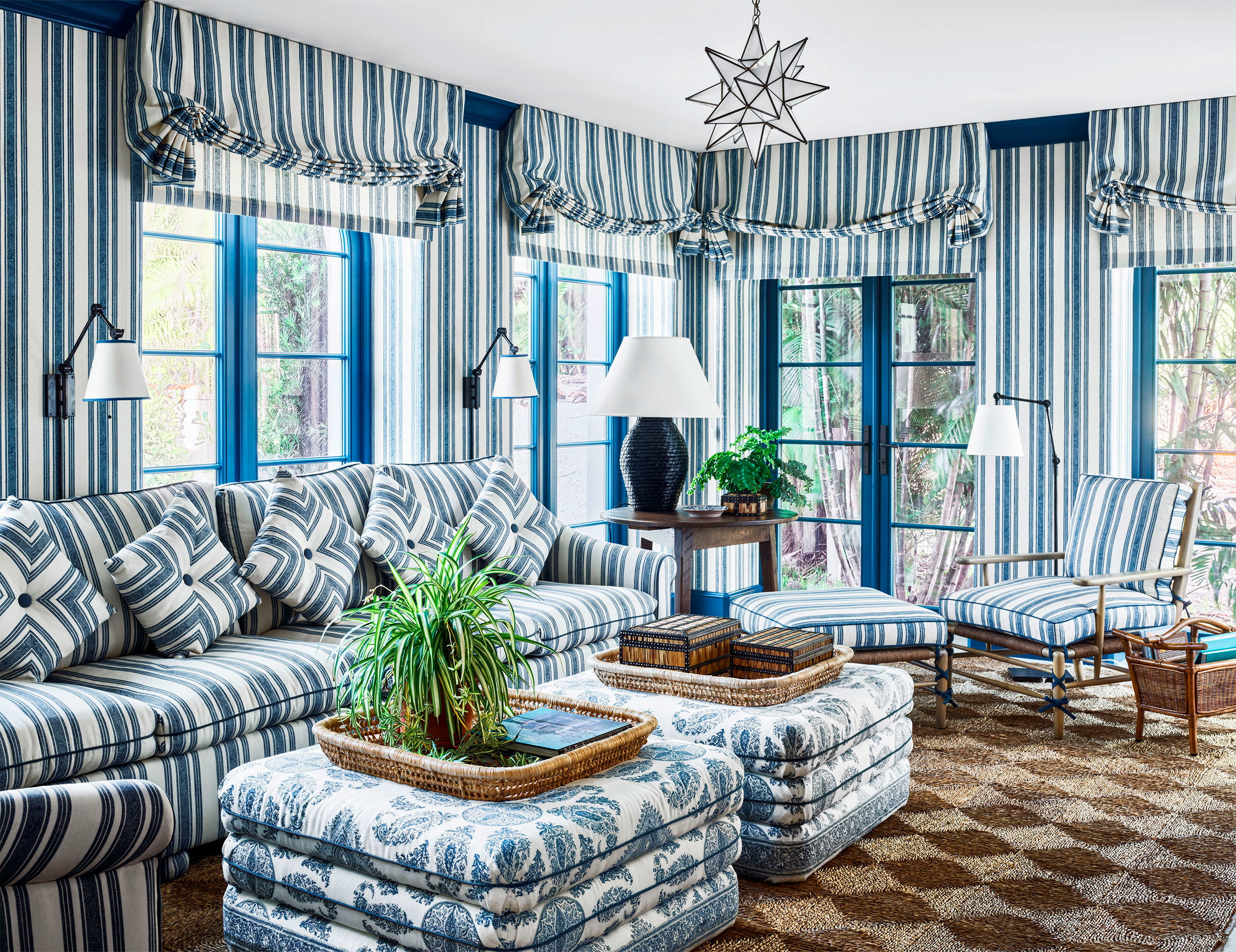 a living room with blue and white striped walls
