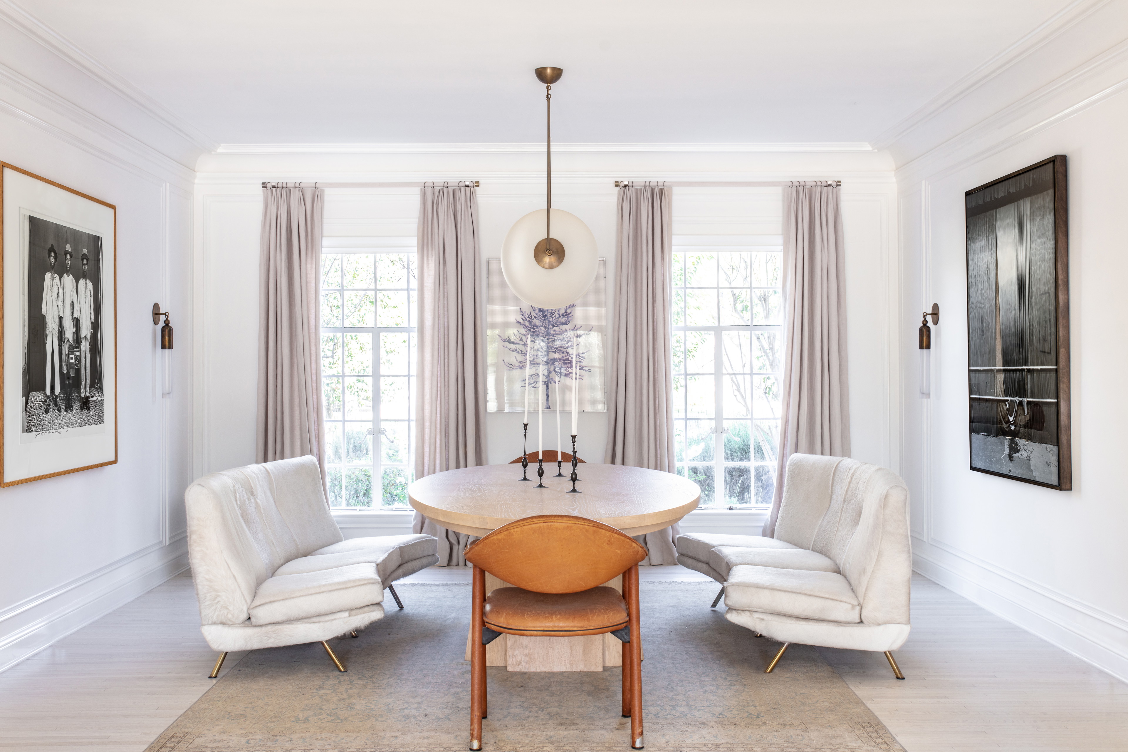 a dining room with a table and chairs