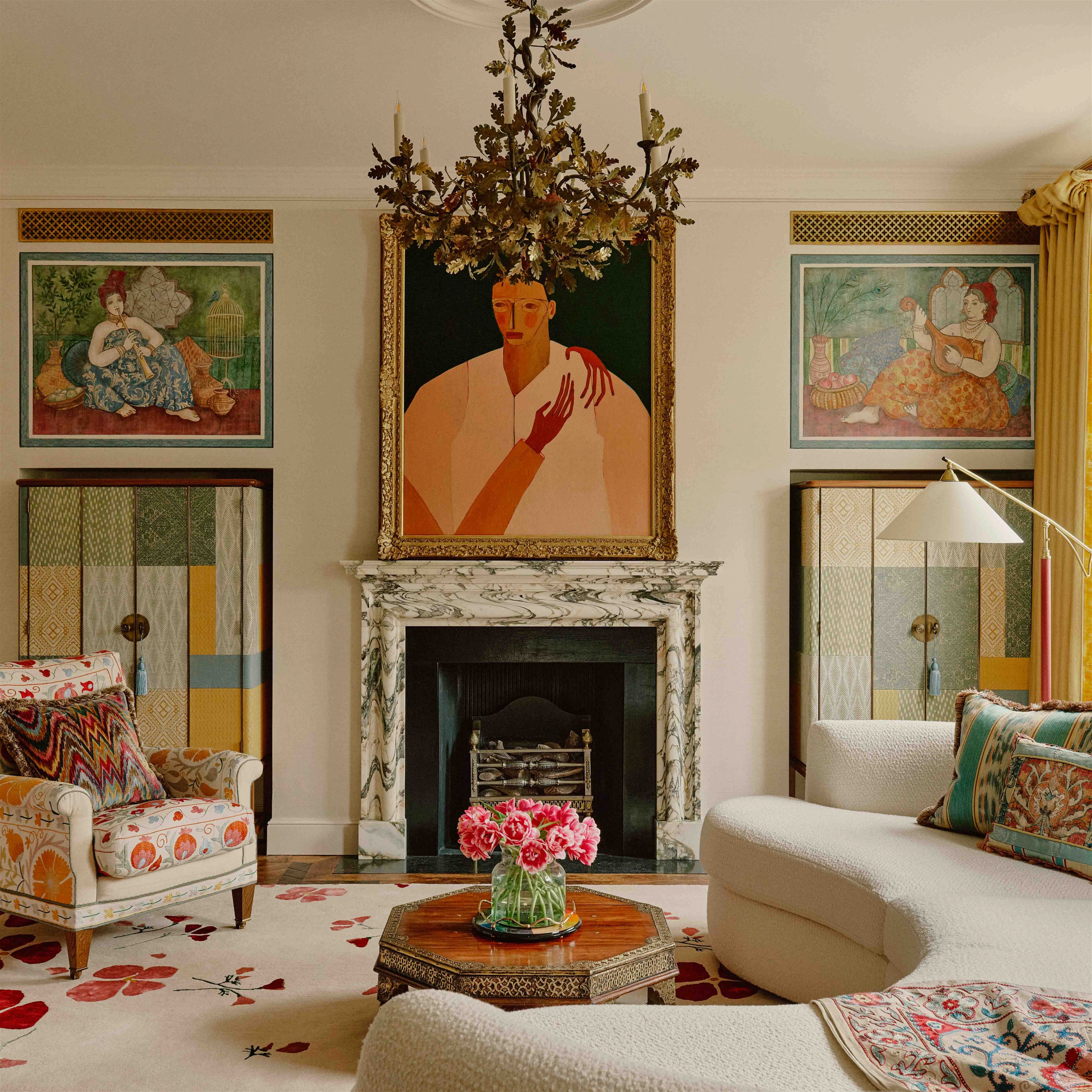 a living room filled with furniture and paintings