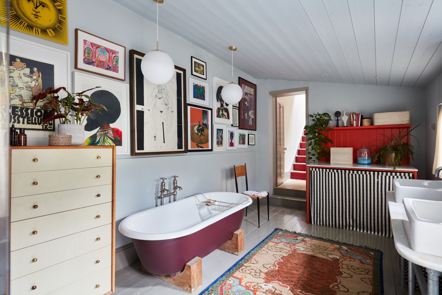 a bathroom with a claw foot tub and a rug