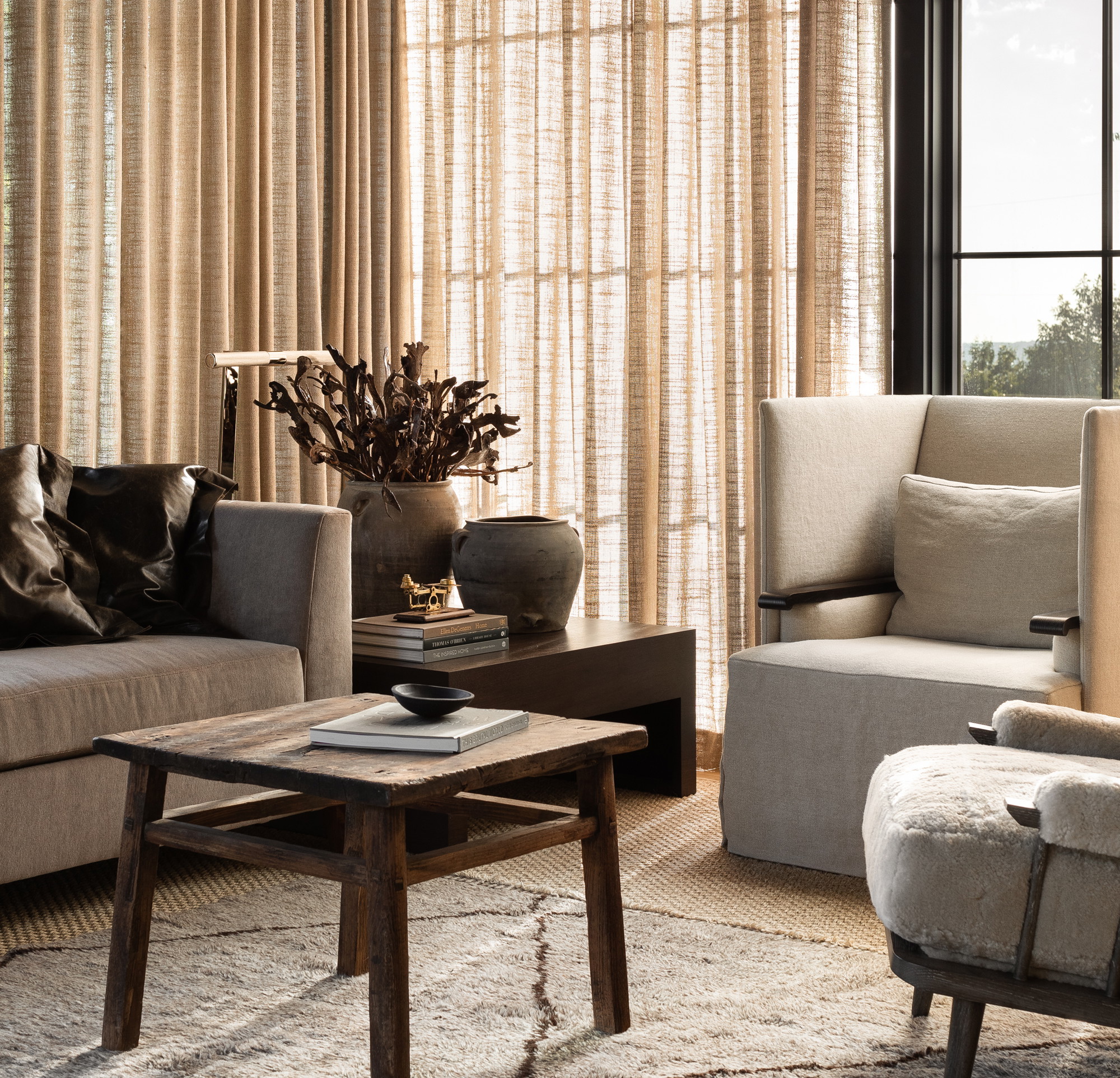 a living room filled with furniture and a large window