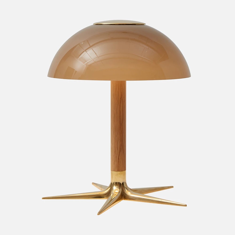 a table lamp with a wooden base and a beige shade