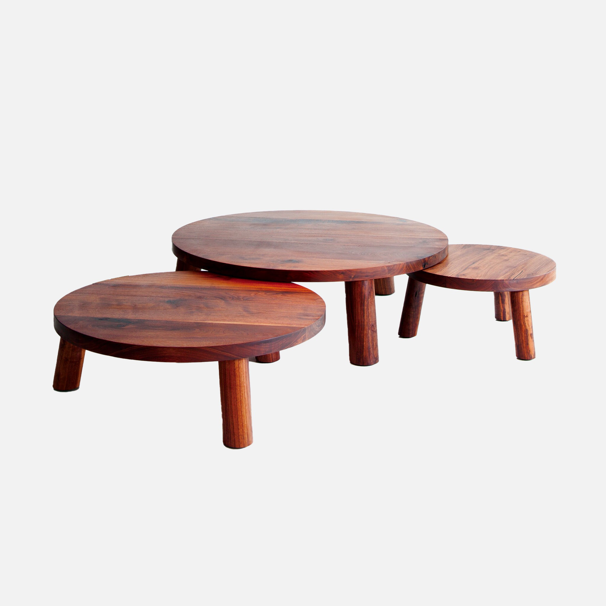 three wooden tables sitting on top of each other