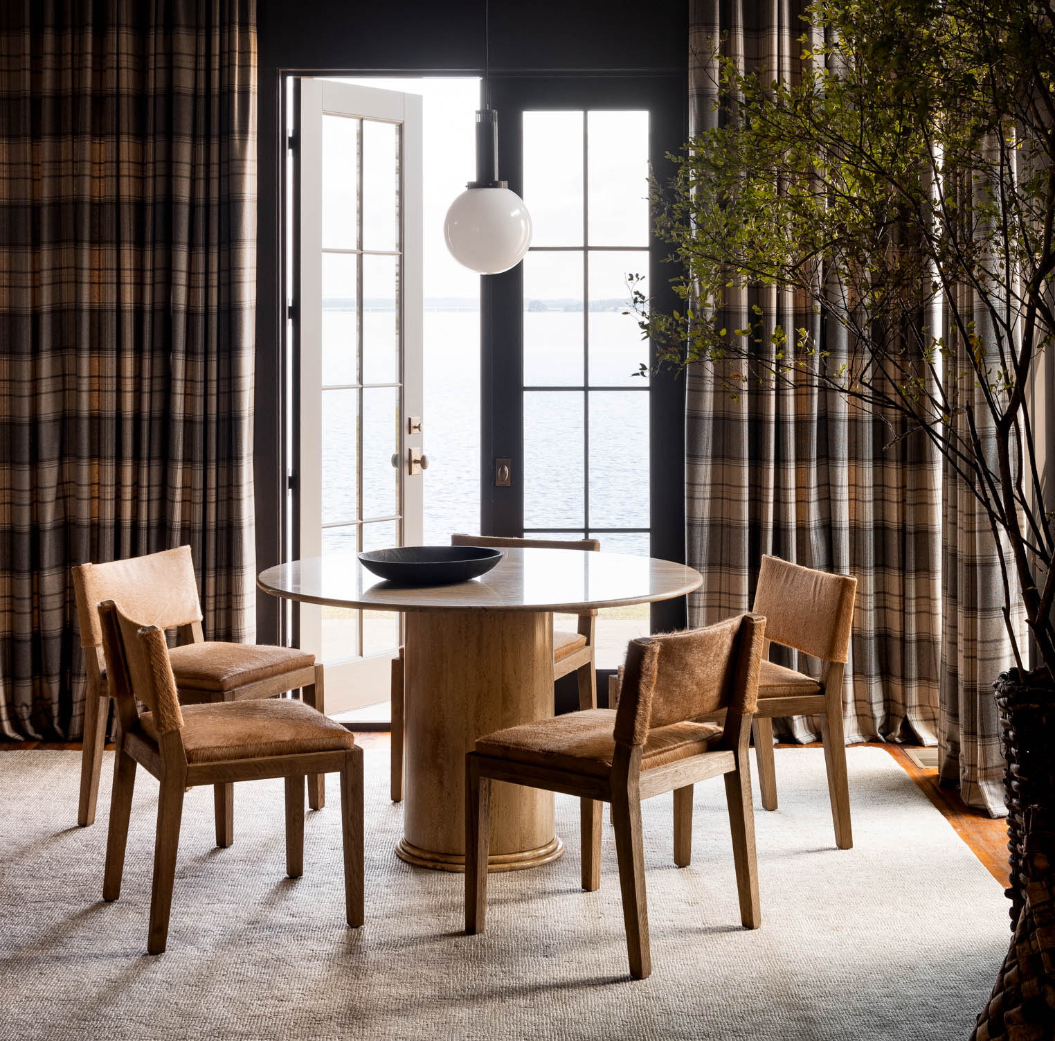 a dining room with a table and chairs