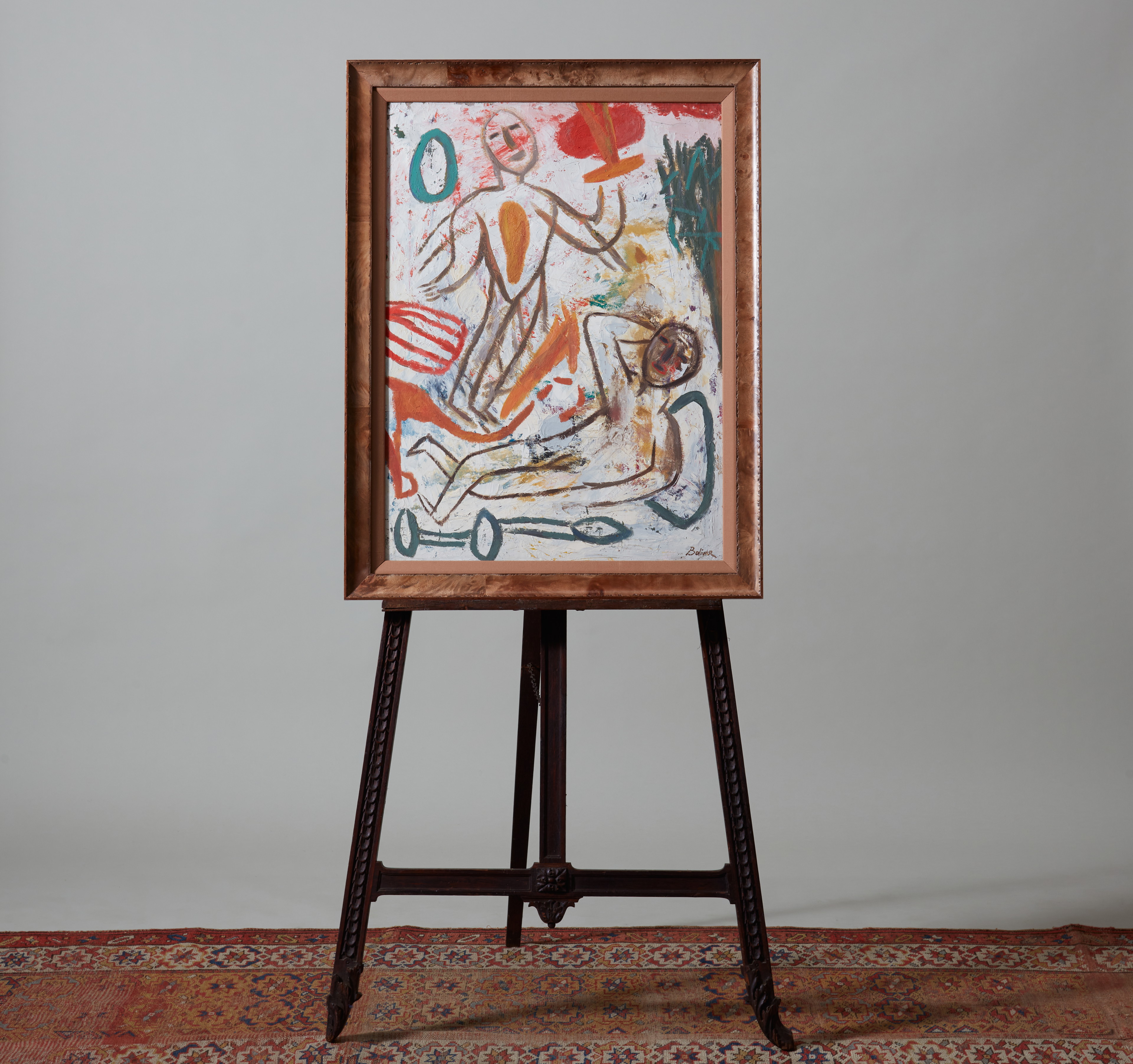 an easel with a painting on it in a room