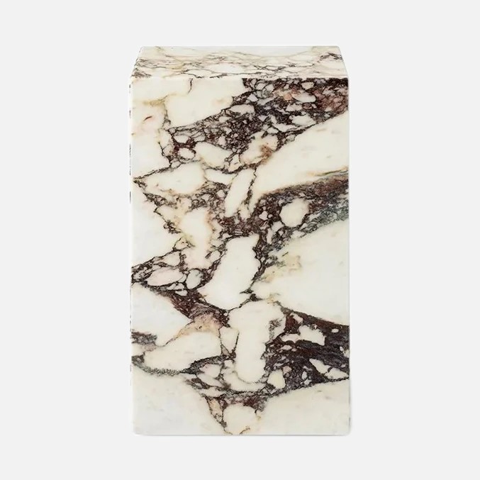 a white and black marble block on a white background