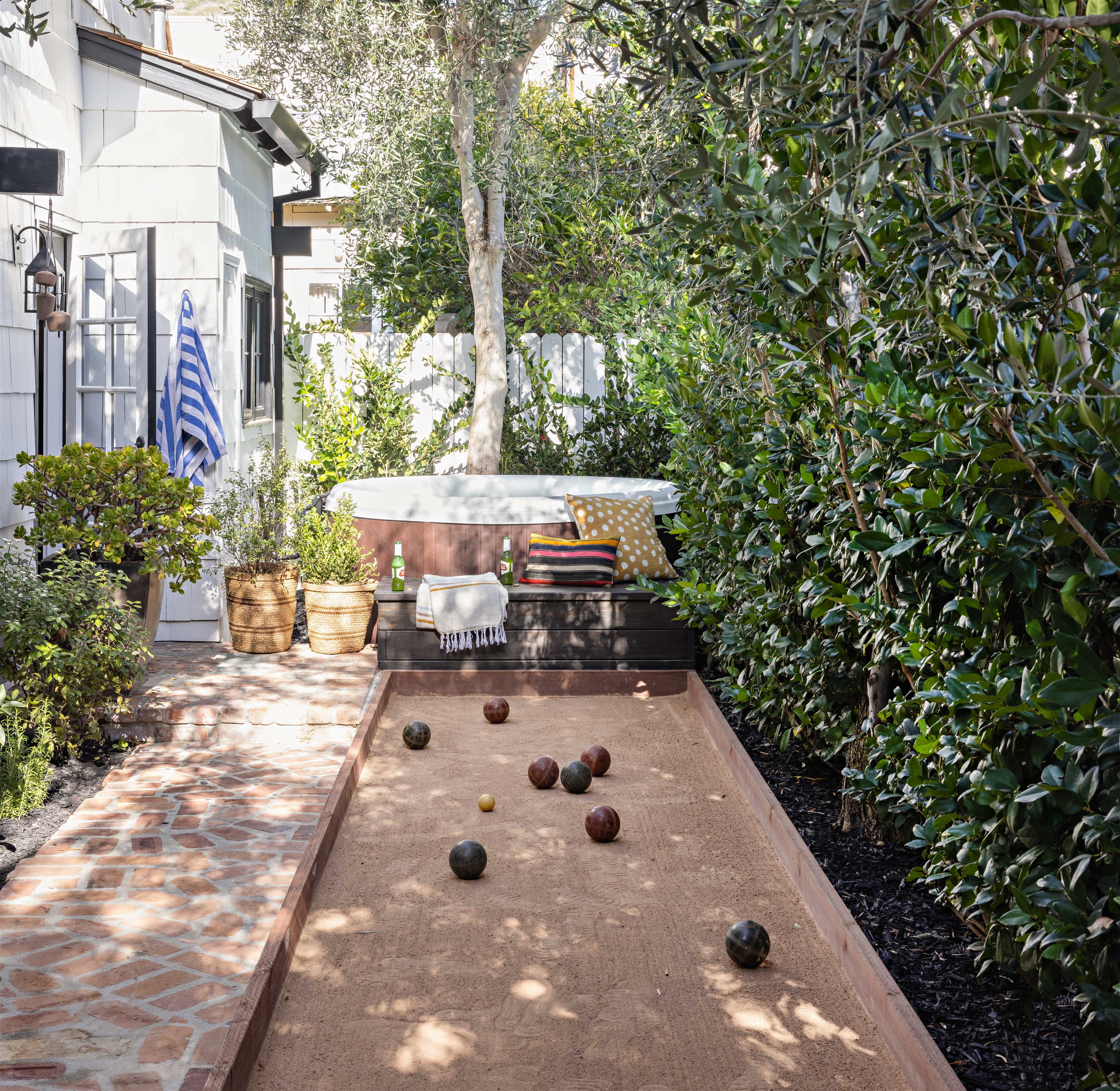 a backyard with a shuffle board and trees