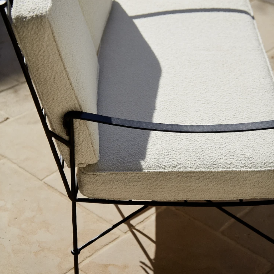 a close up of a chair on a tile floor