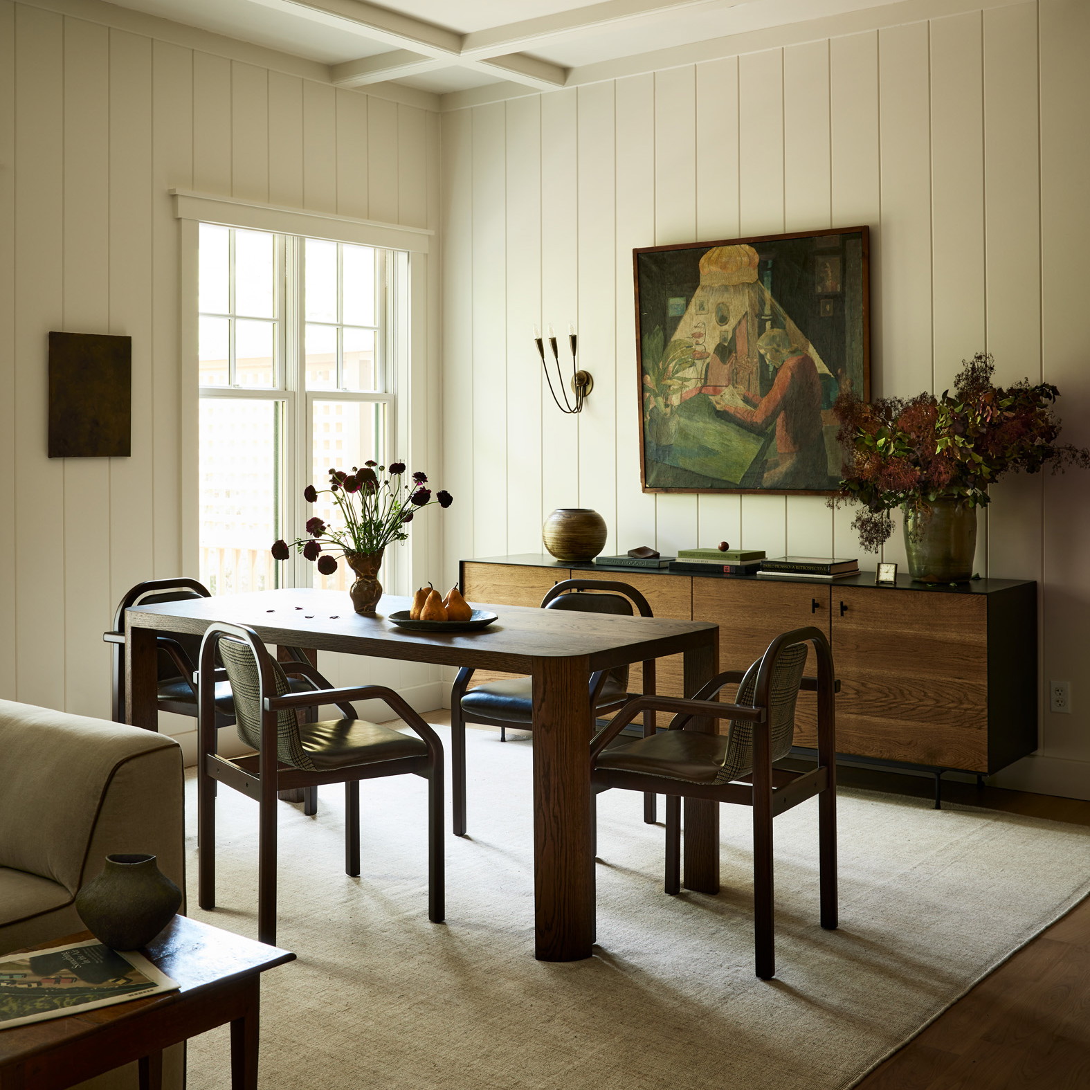 a dining room with a table and chairs