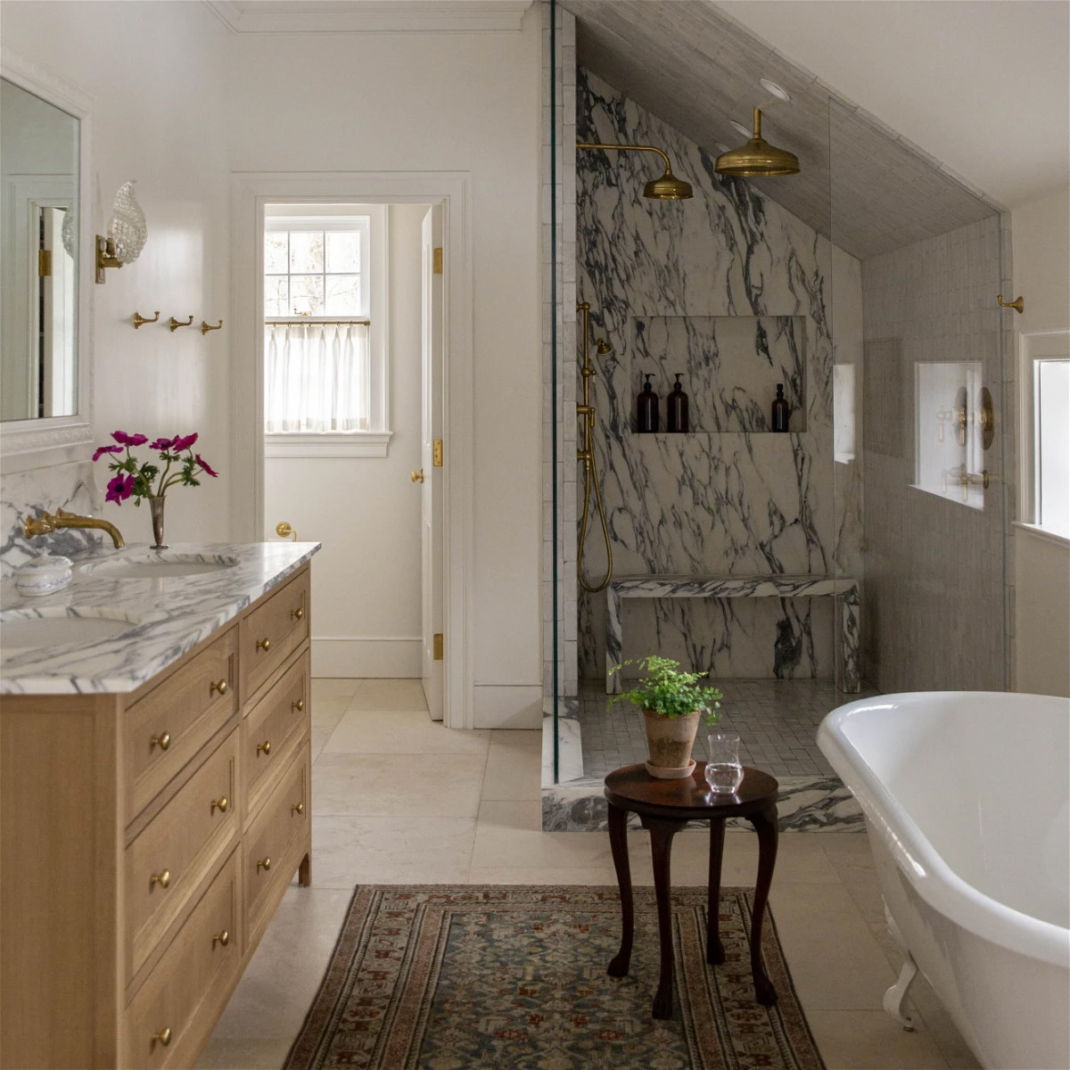 a bath room with a bath tub a sink and a mirror