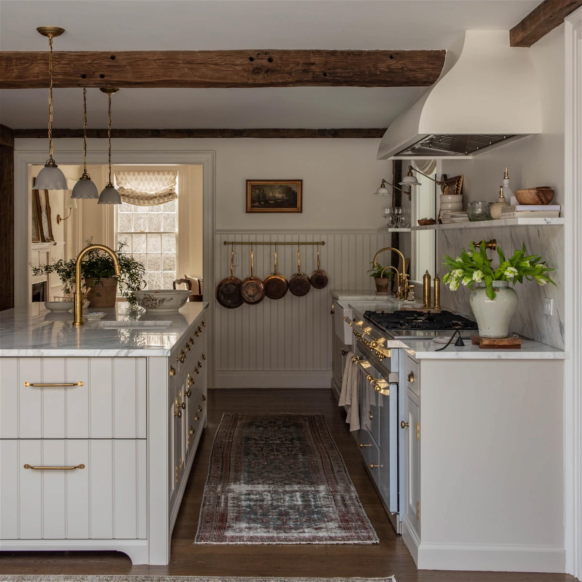 a kitchen with a stove top oven sitting under a window