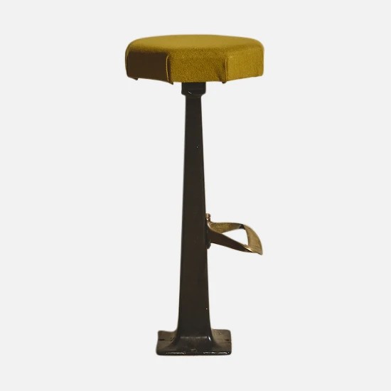 a stool with a yellow seat and a black base