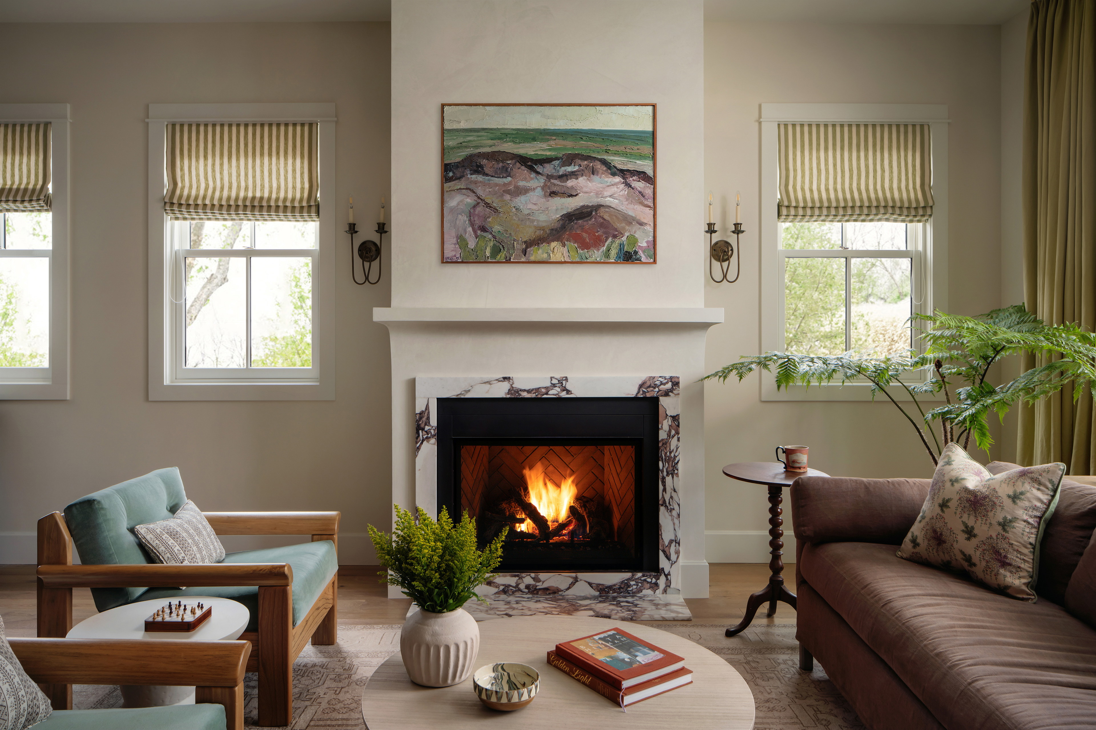 a living room filled with furniture and a fire place