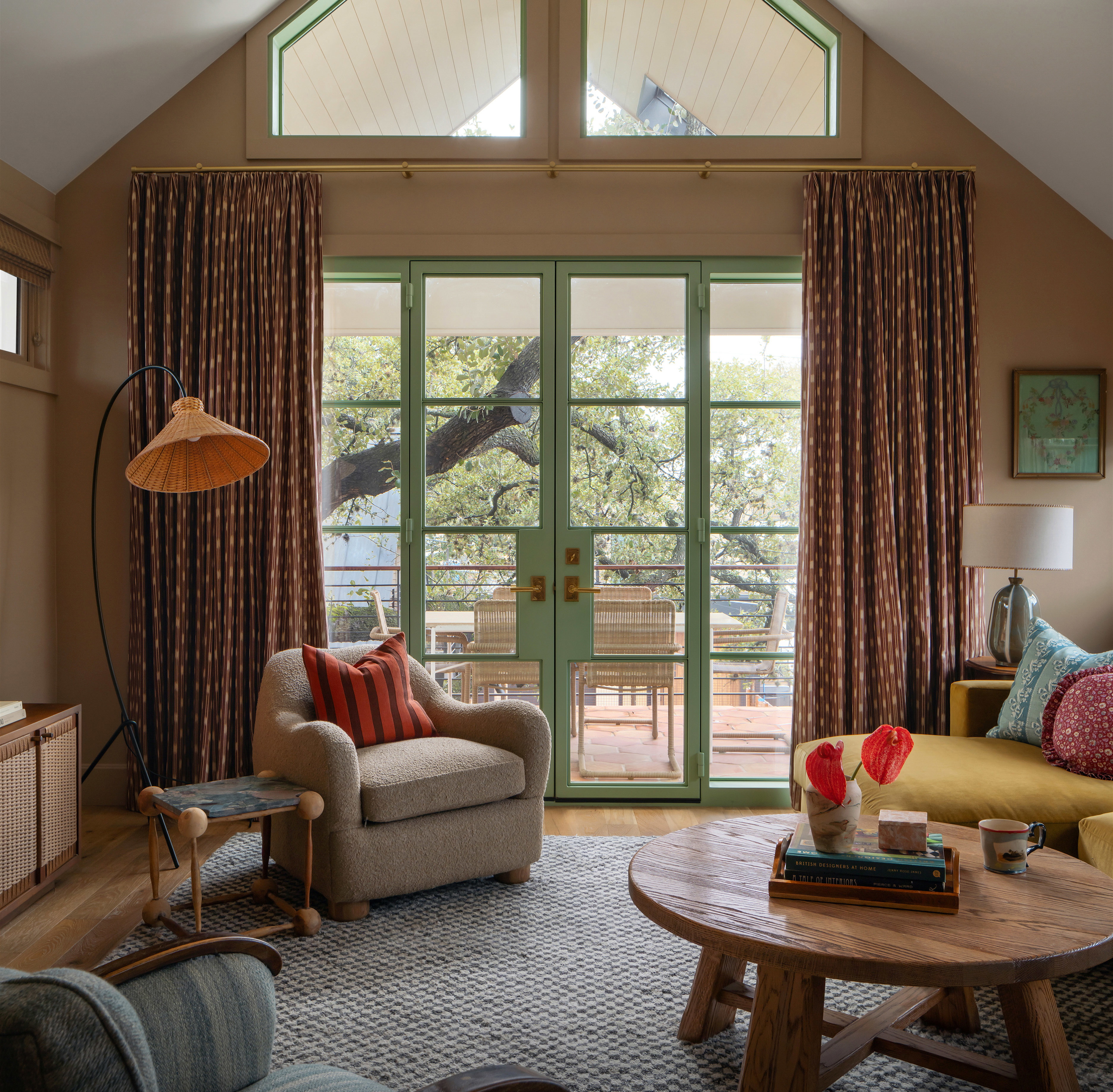 a living room filled with furniture and a large window