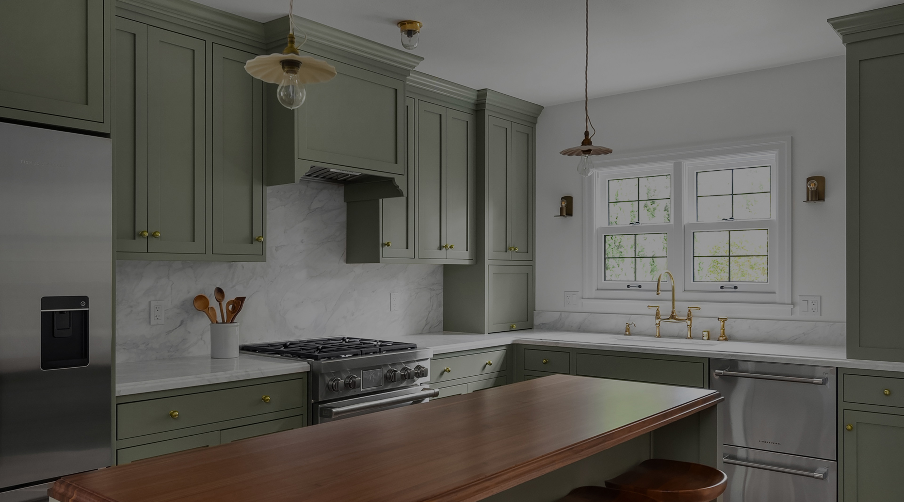 a kitchen with green cabinets and wooden counter tops