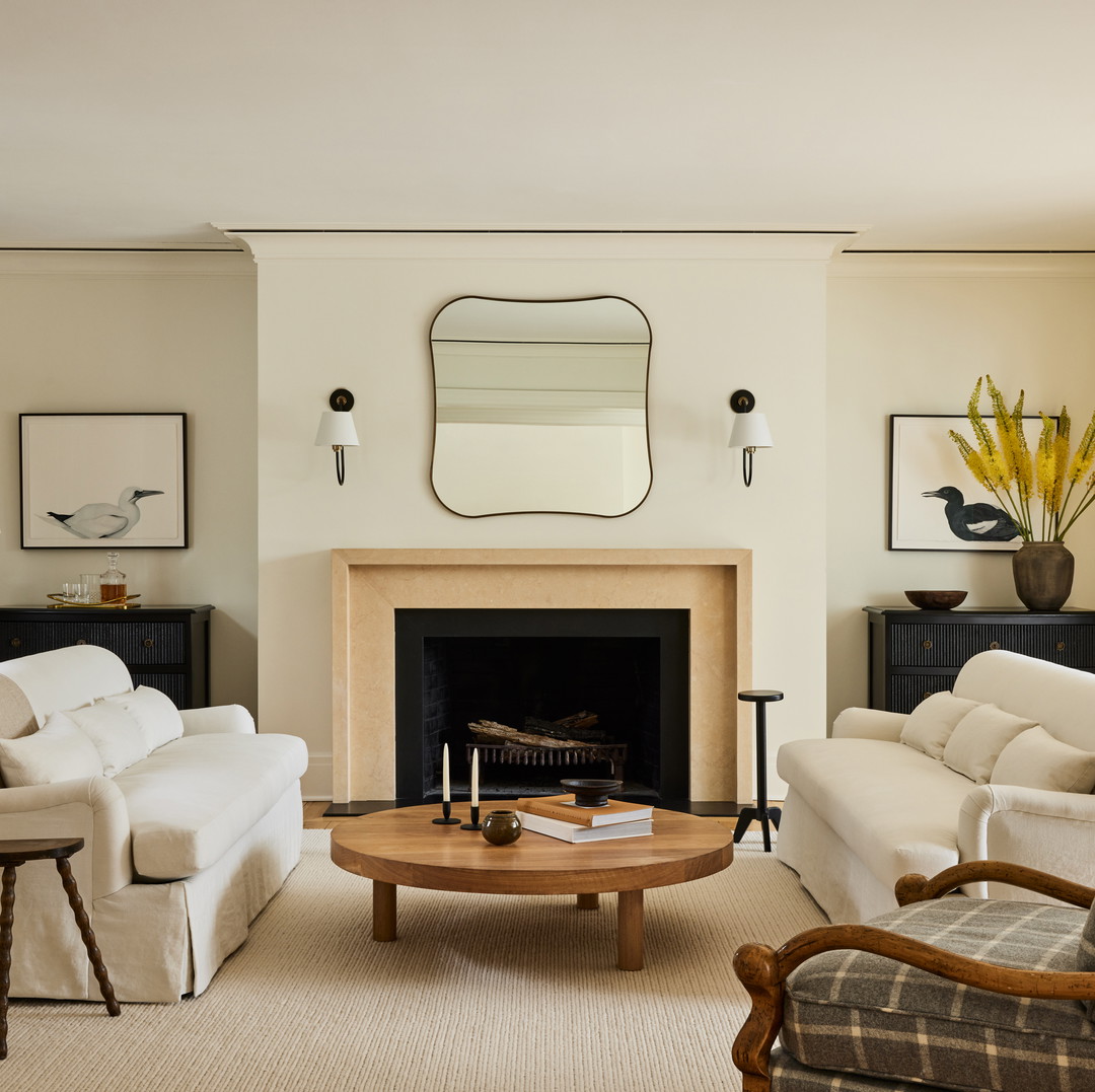 a living room filled with furniture and a fire place