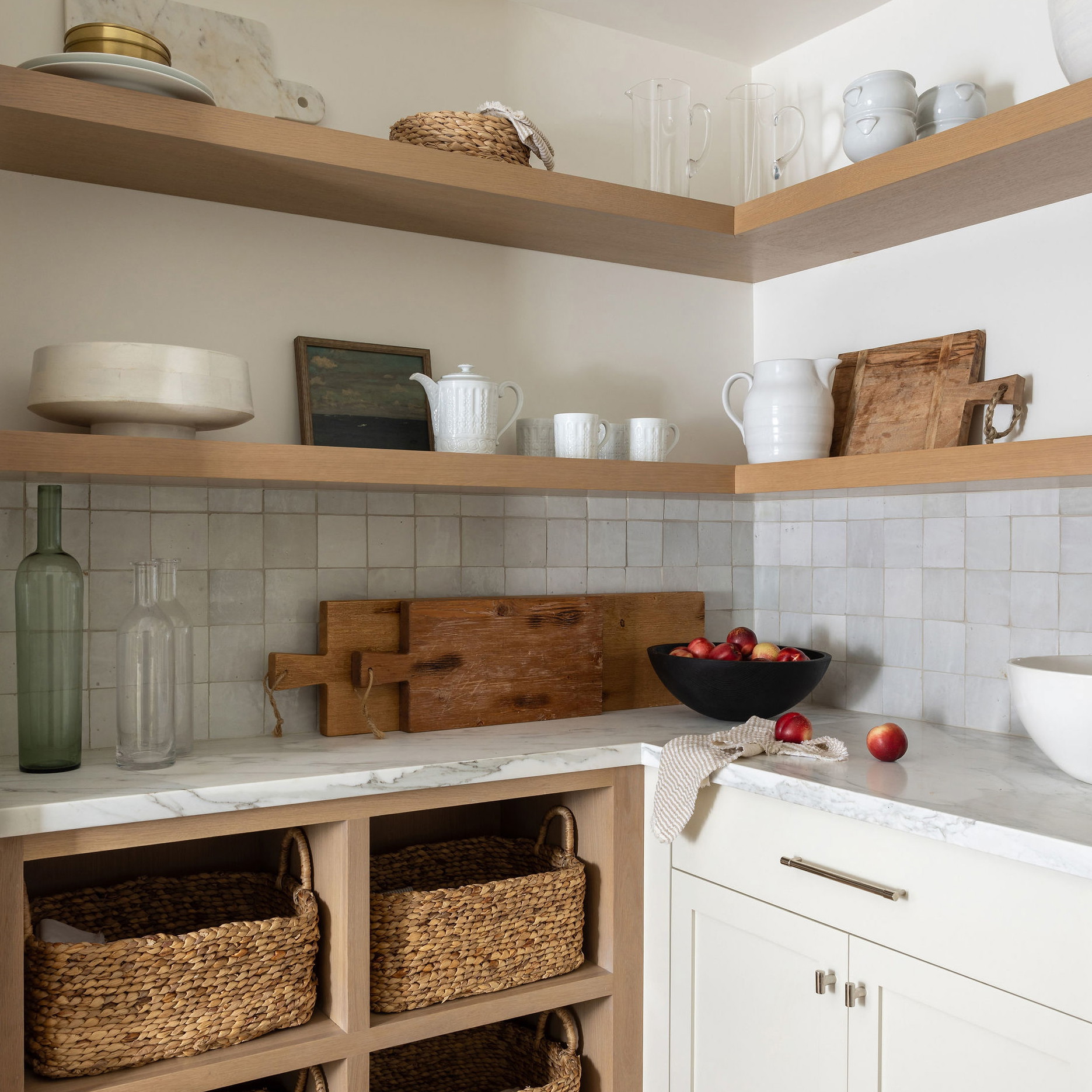 a kitchen filled with lots of open shelves