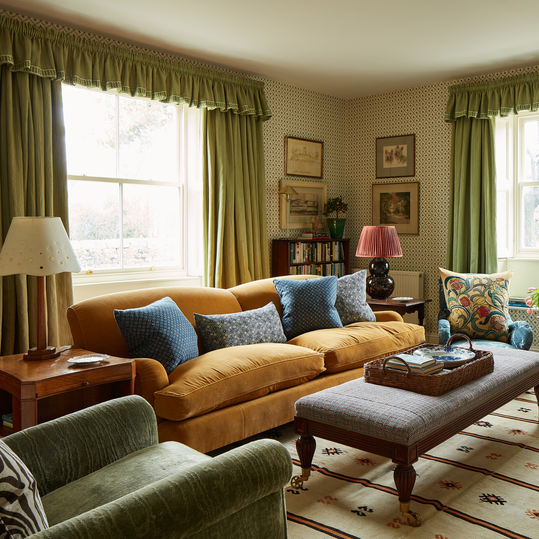 a living room filled with furniture and a fire place