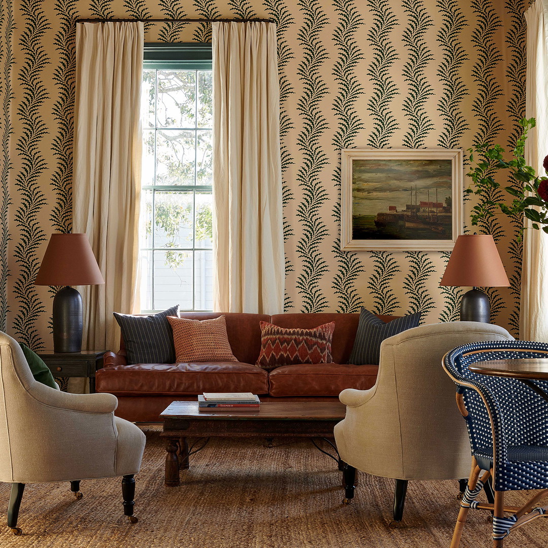 a living room filled with furniture and a window