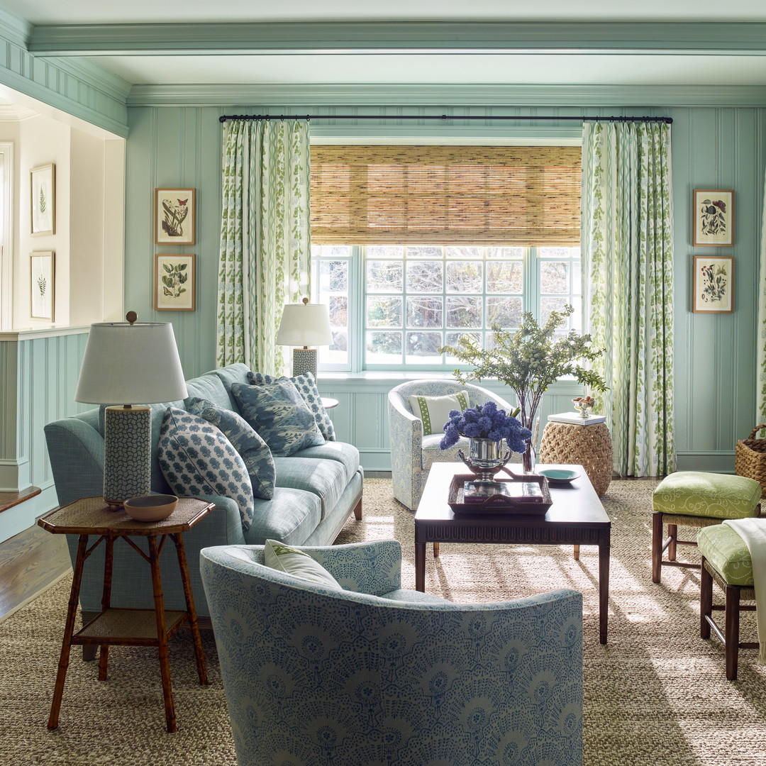 a living room filled with furniture and a flat screen tv