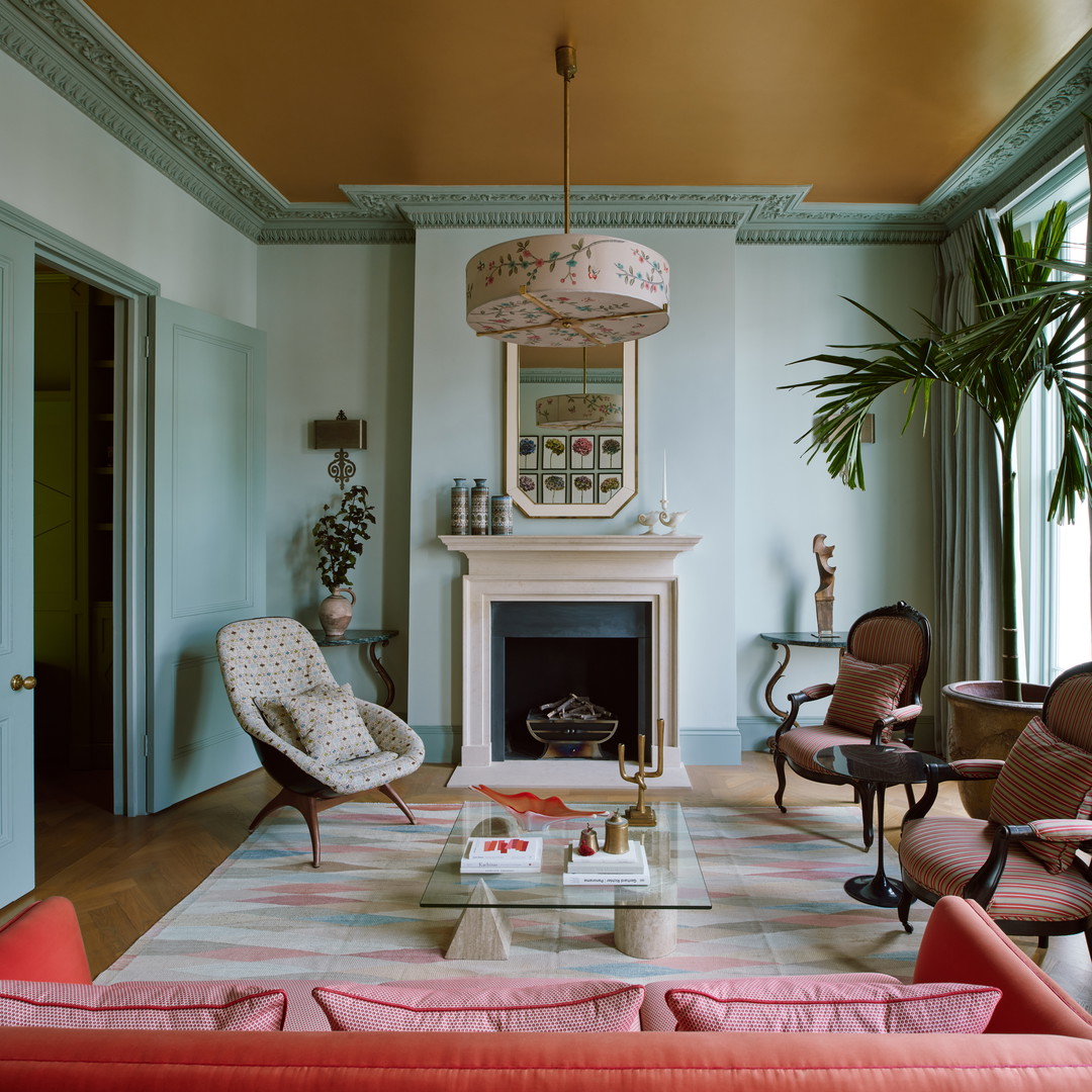 a living room filled with furniture and a fire place