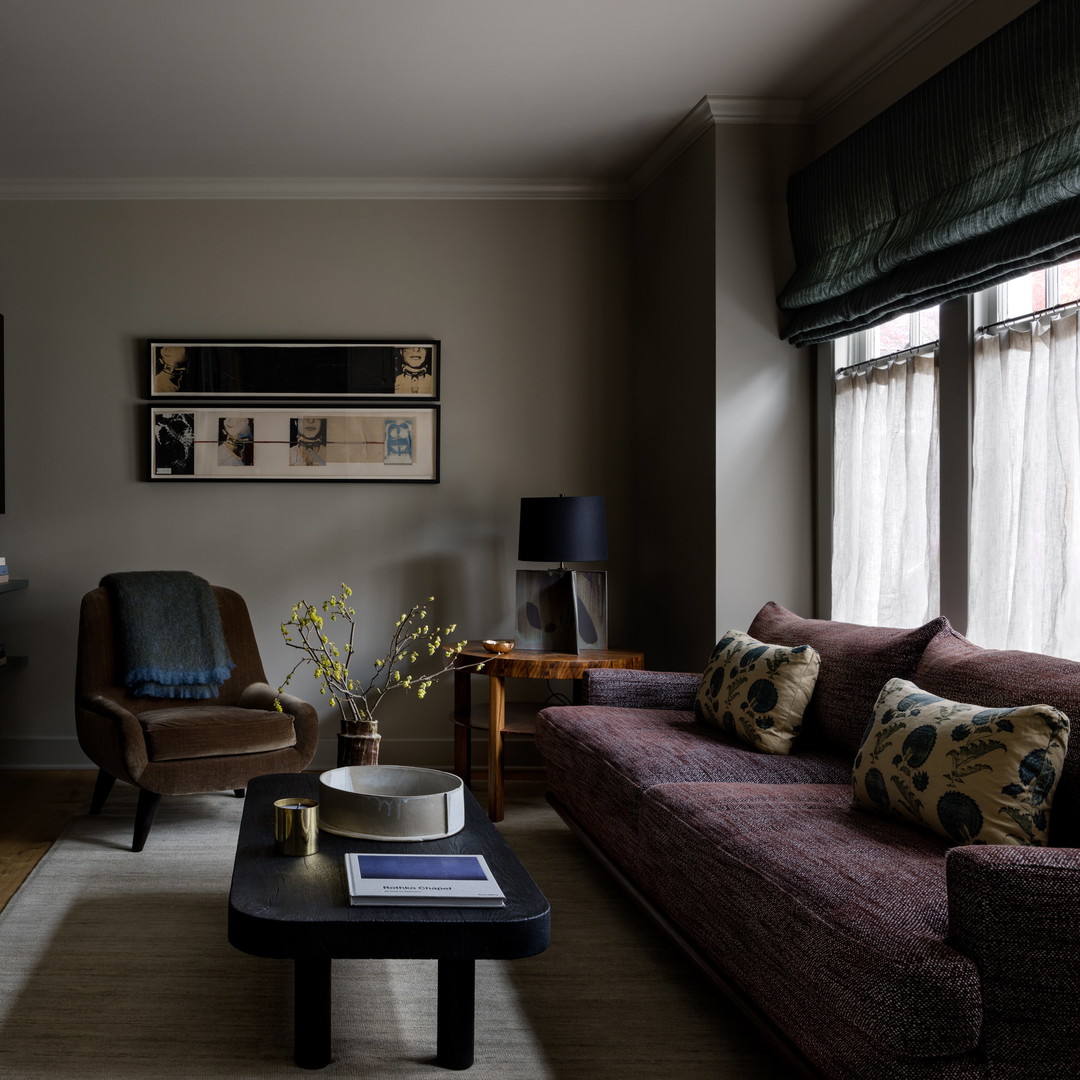 a living room filled with furniture and a fire place