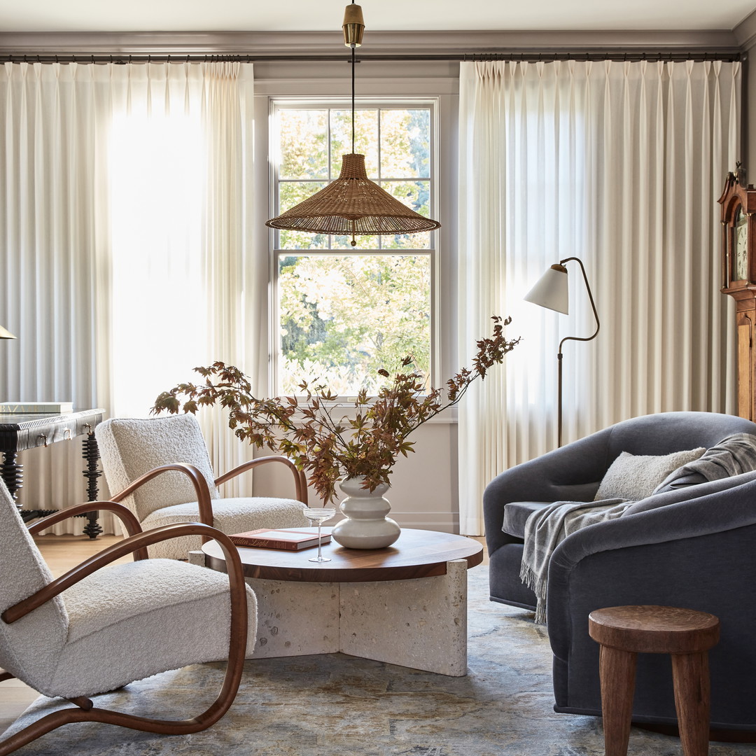 a living room filled with furniture and a piano