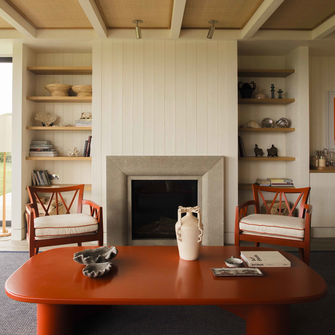 a living room filled with furniture and a fire place