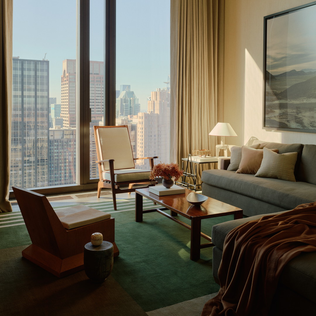 a living room filled with furniture and a large window