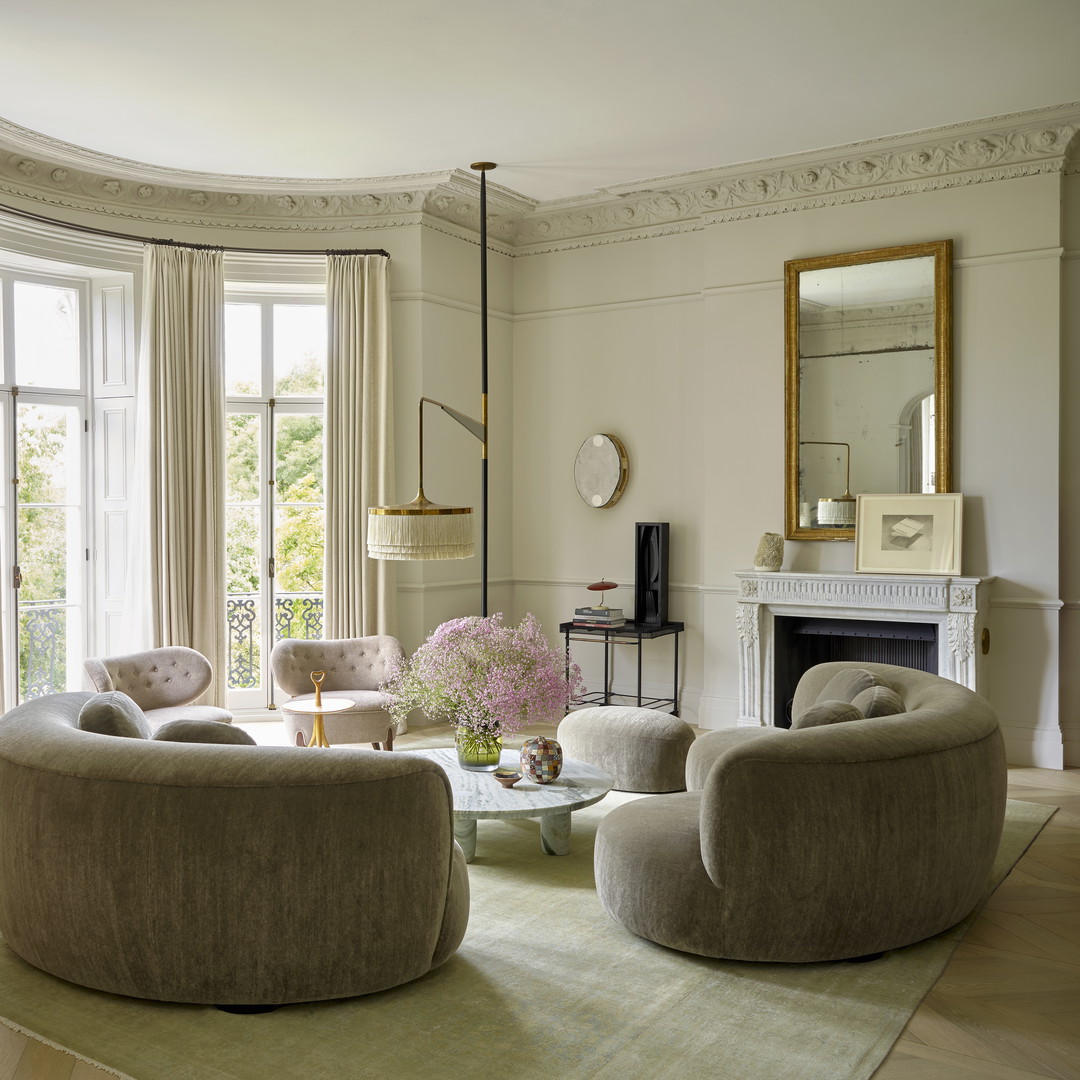 a living room filled with furniture and a fire place