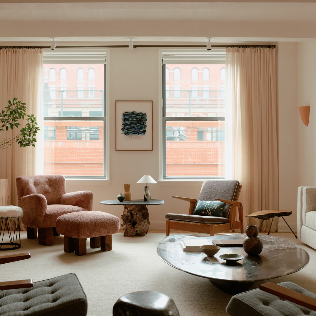 a living room filled with furniture and a large window