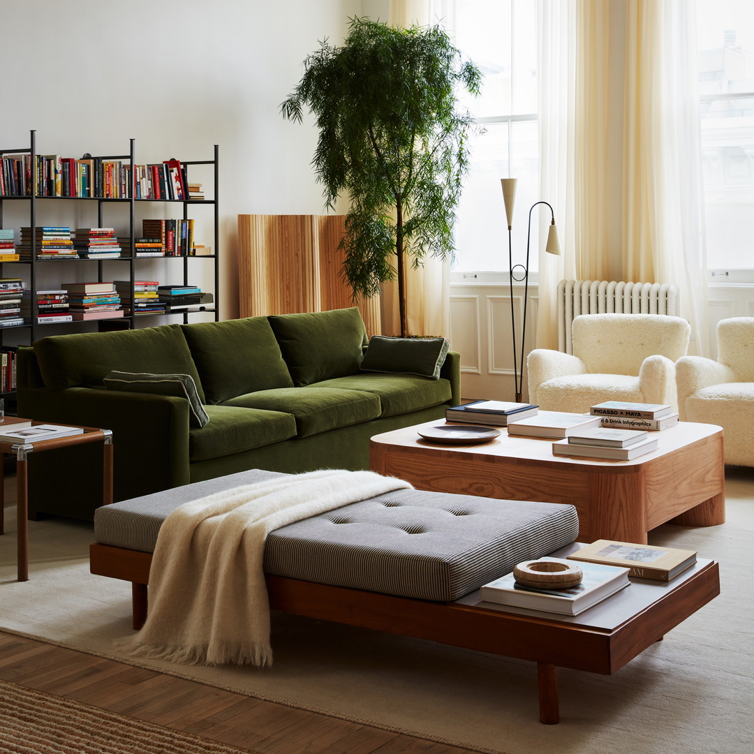 a living room filled with furniture and a large window