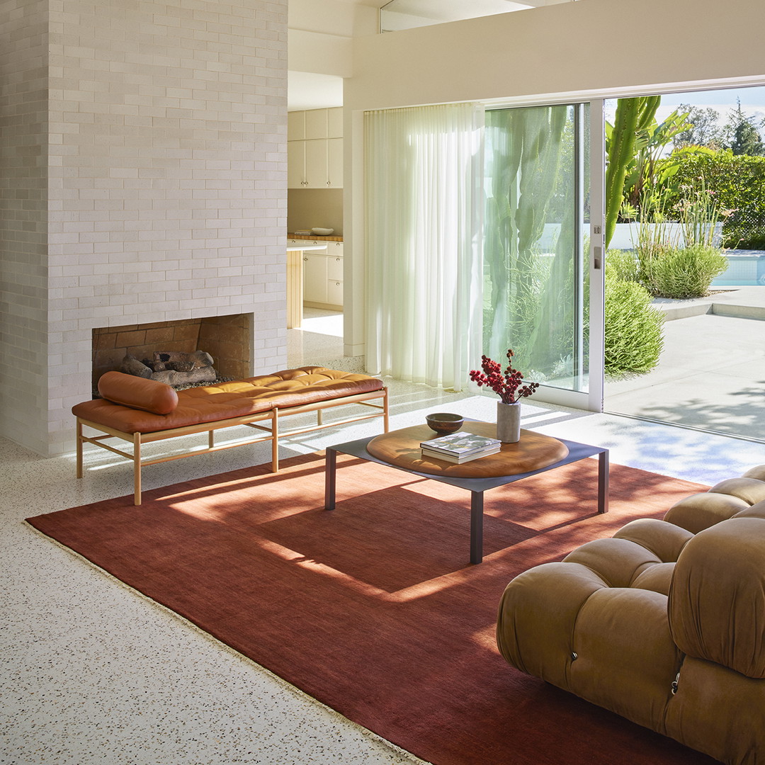 a living room filled with furniture and a fire place