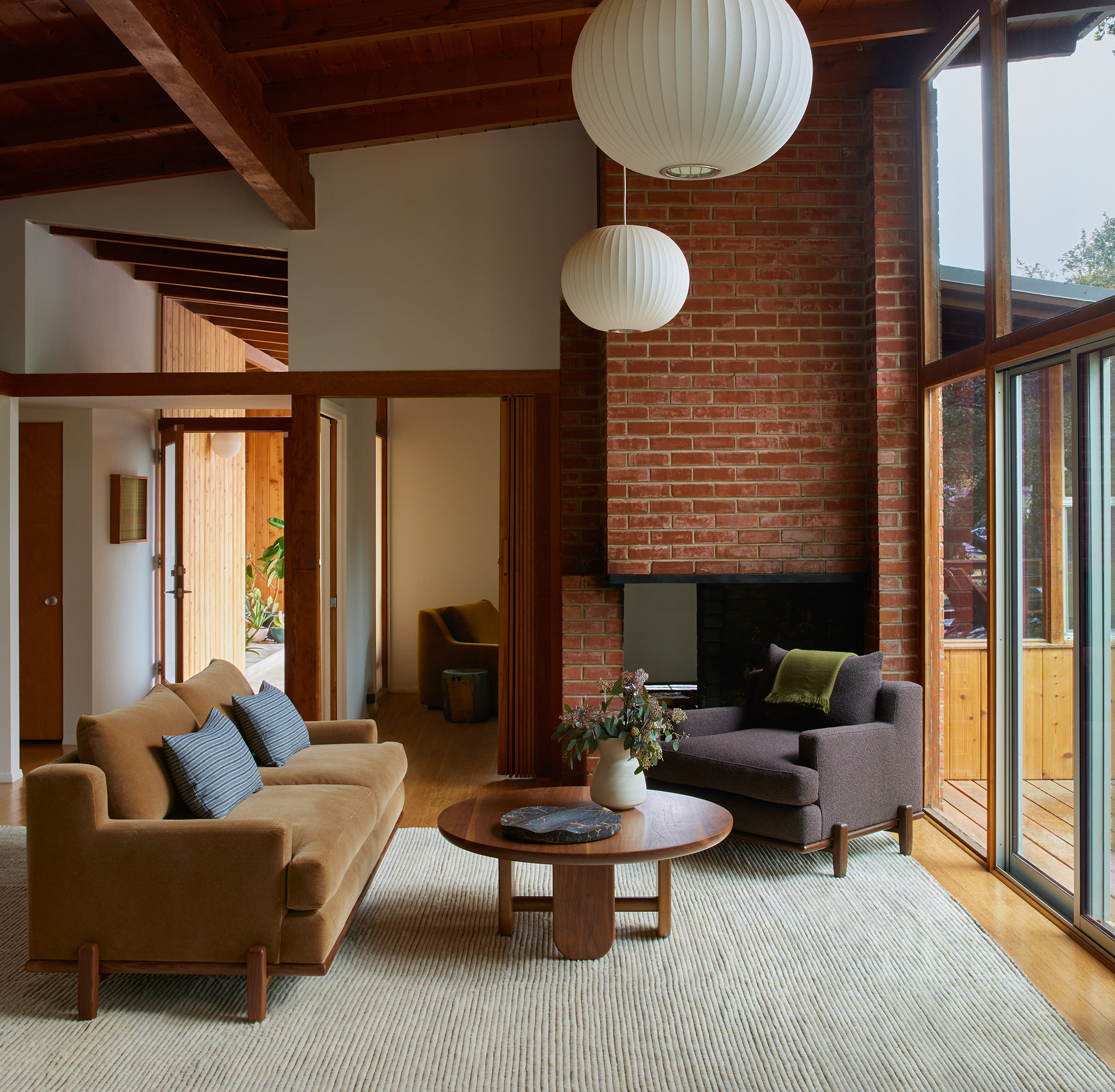 a living room filled with furniture and a fire place