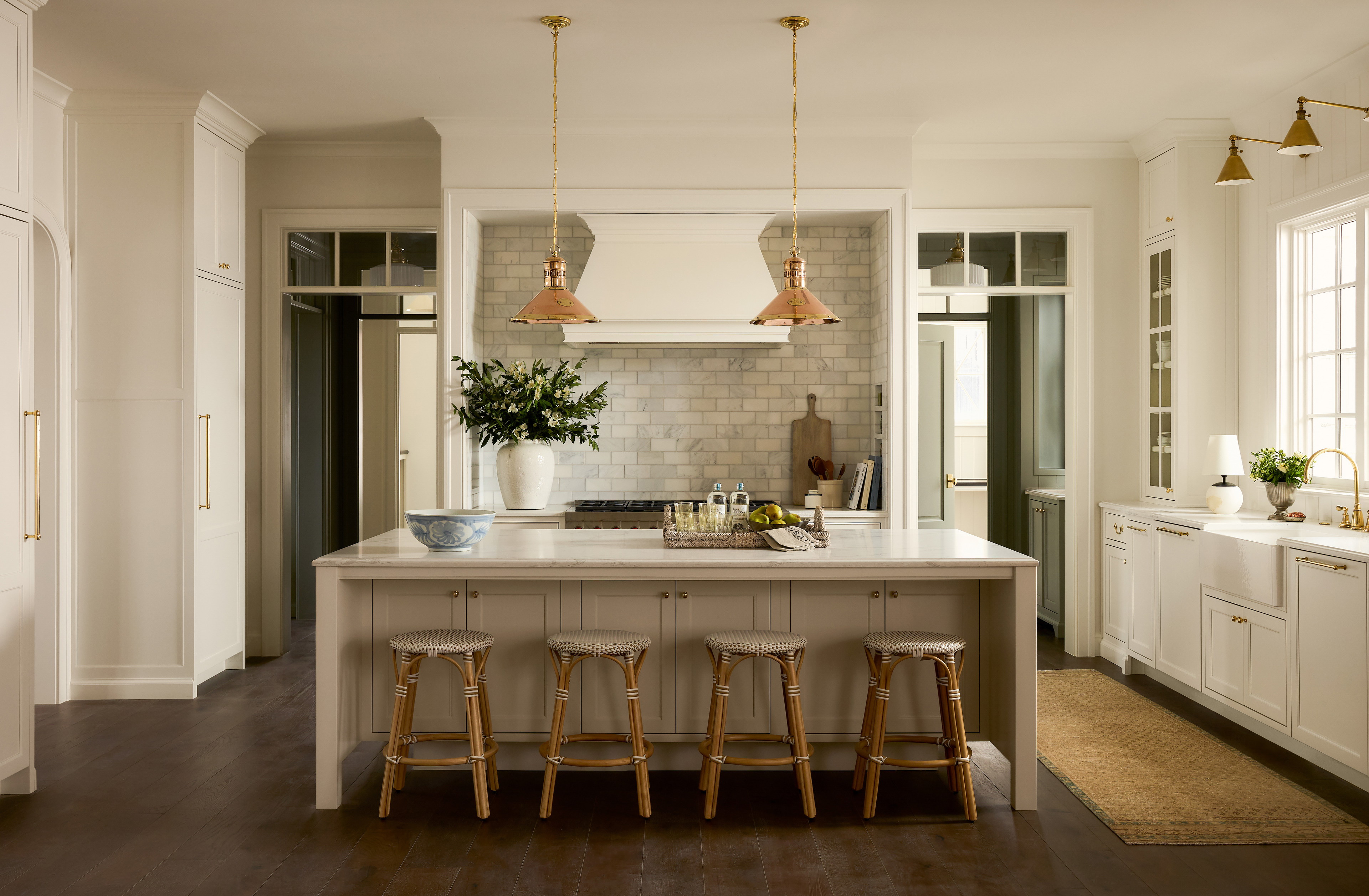 a kitchen with a center island with stools