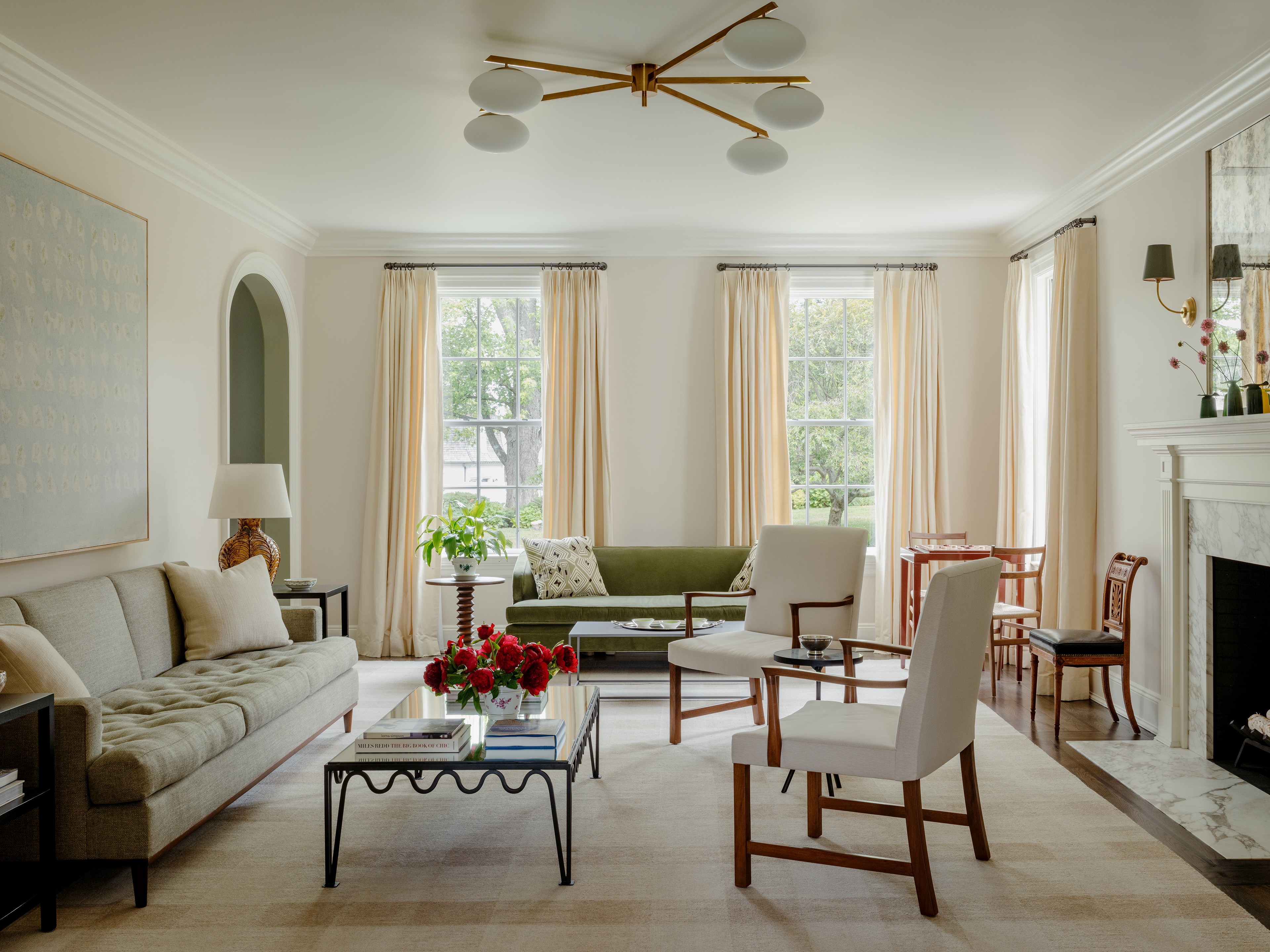 a living room filled with furniture and a fire place