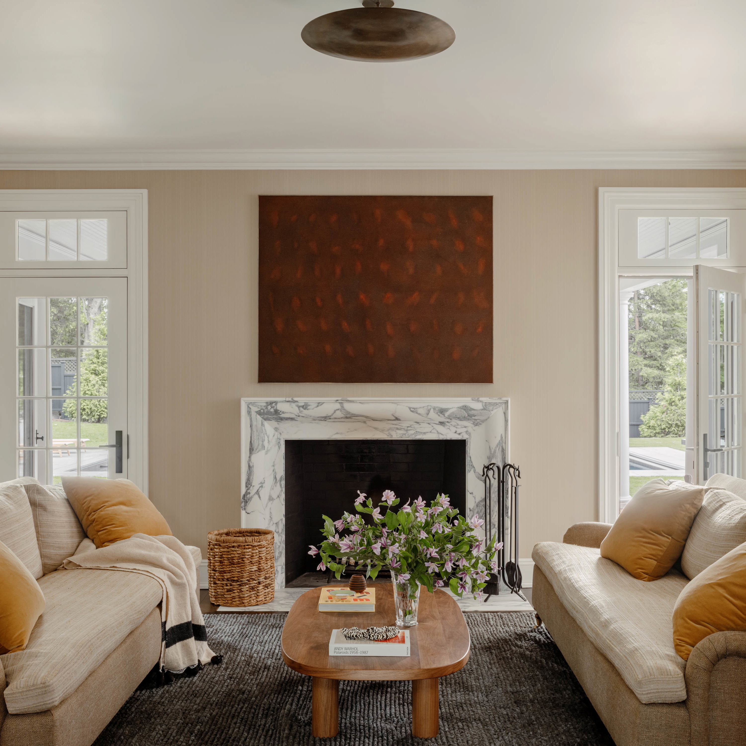 a living room filled with furniture and a fire place